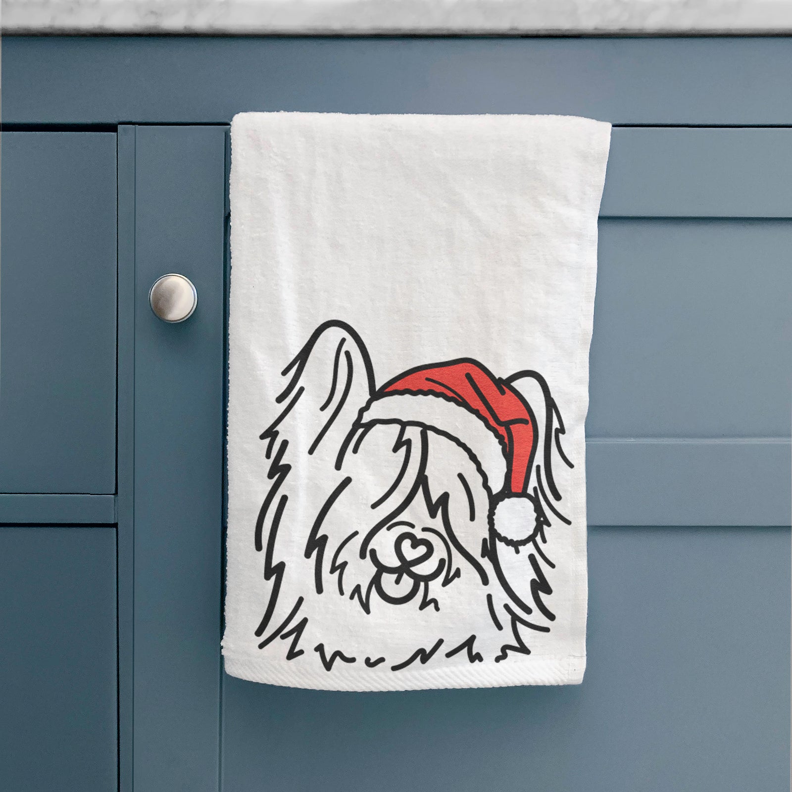 Minimalist line drawing of Dougal the Skye Terrier wearing a Santa hat on a hand towel