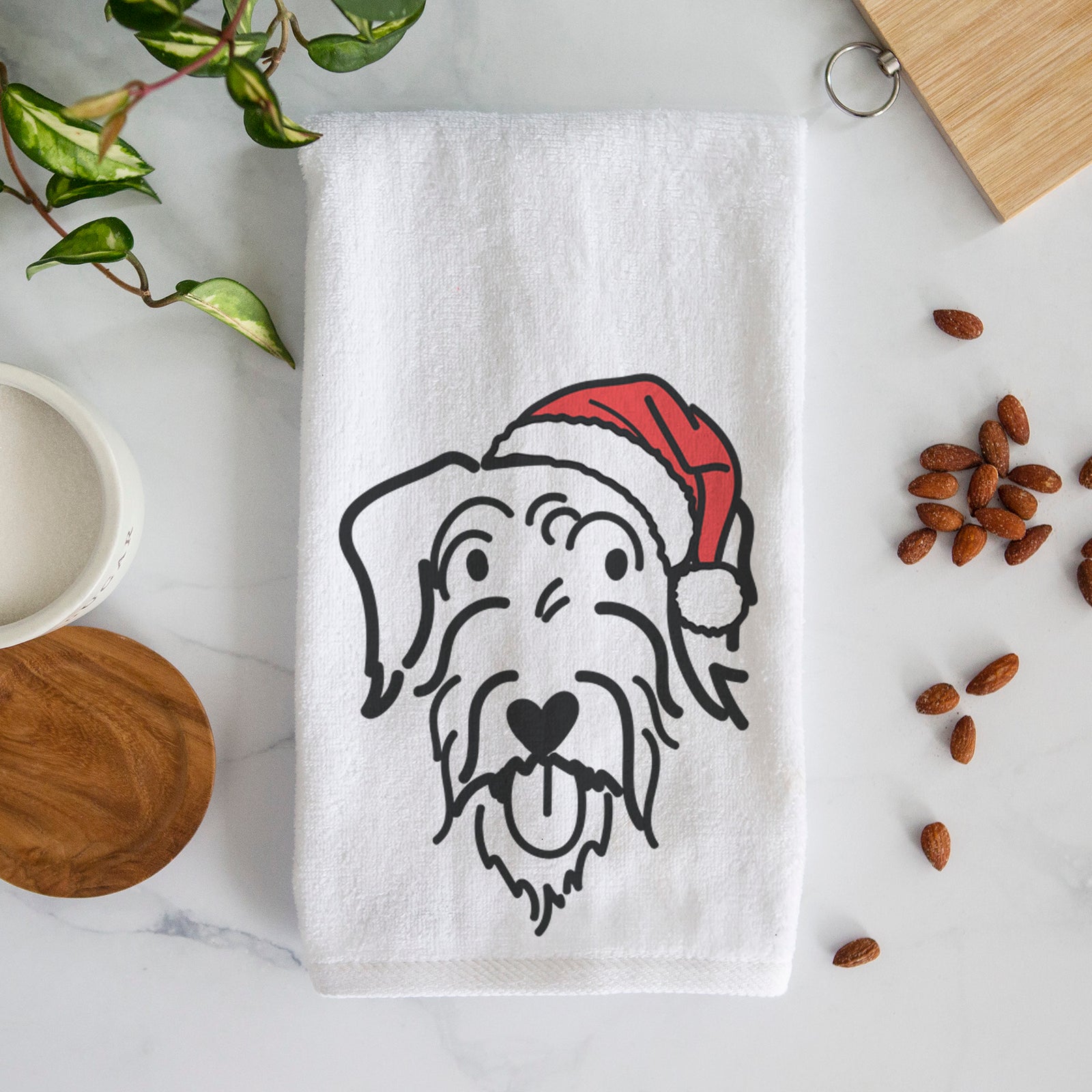 Minimalist line drawing of Dug the Doodle wearing a Santa hat on a decorative hand towel