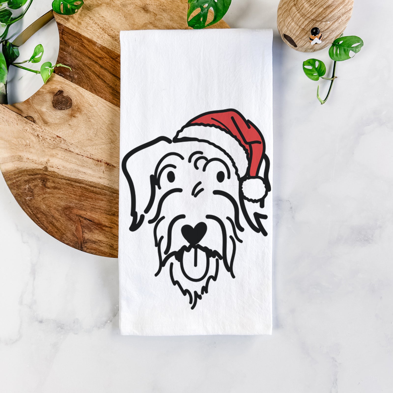 Minimalist line drawing of Dug the Doodle wearing a Santa hat on a tea towel