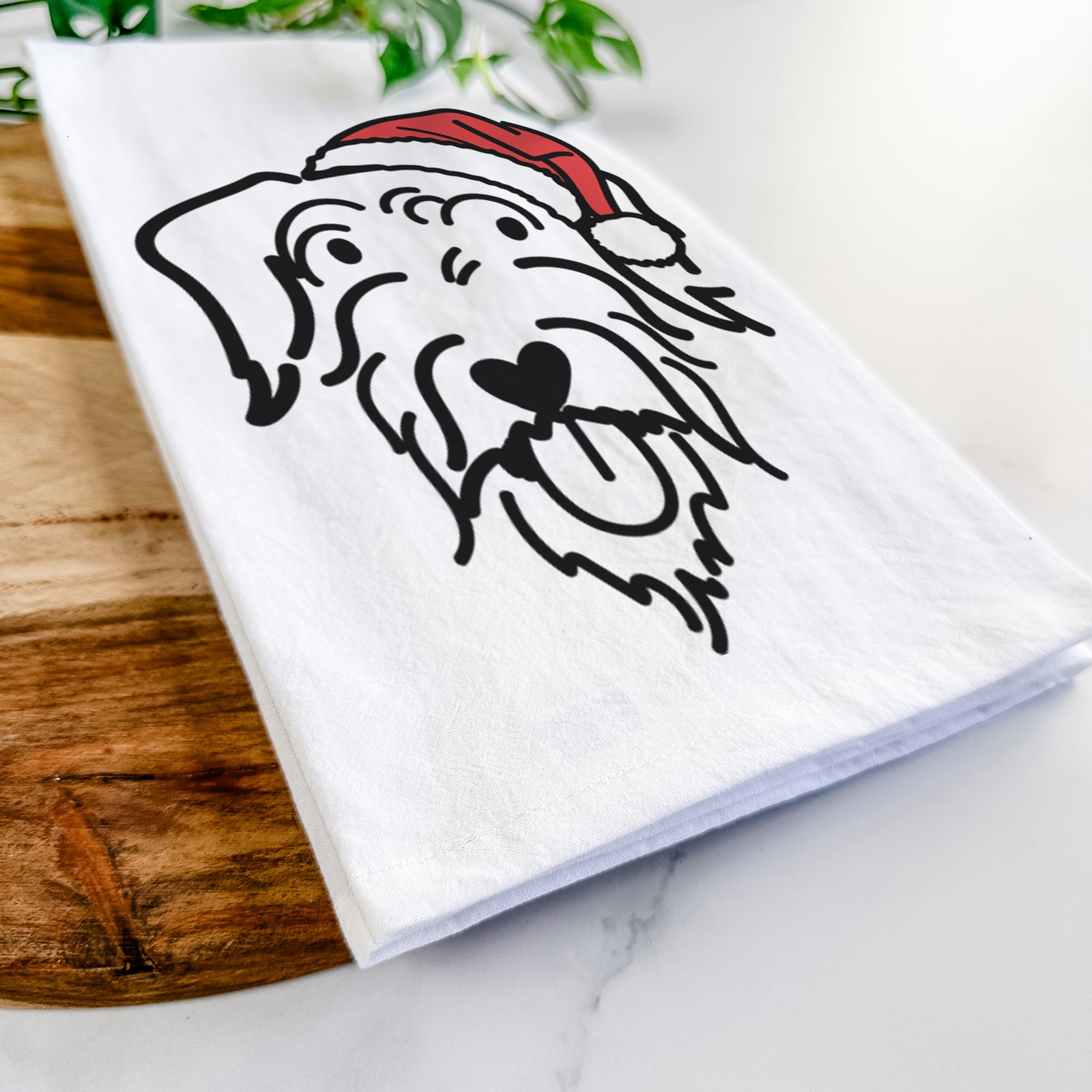 Minimalist line drawing of Dug the Doodle wearing a Santa hat on a tea towel