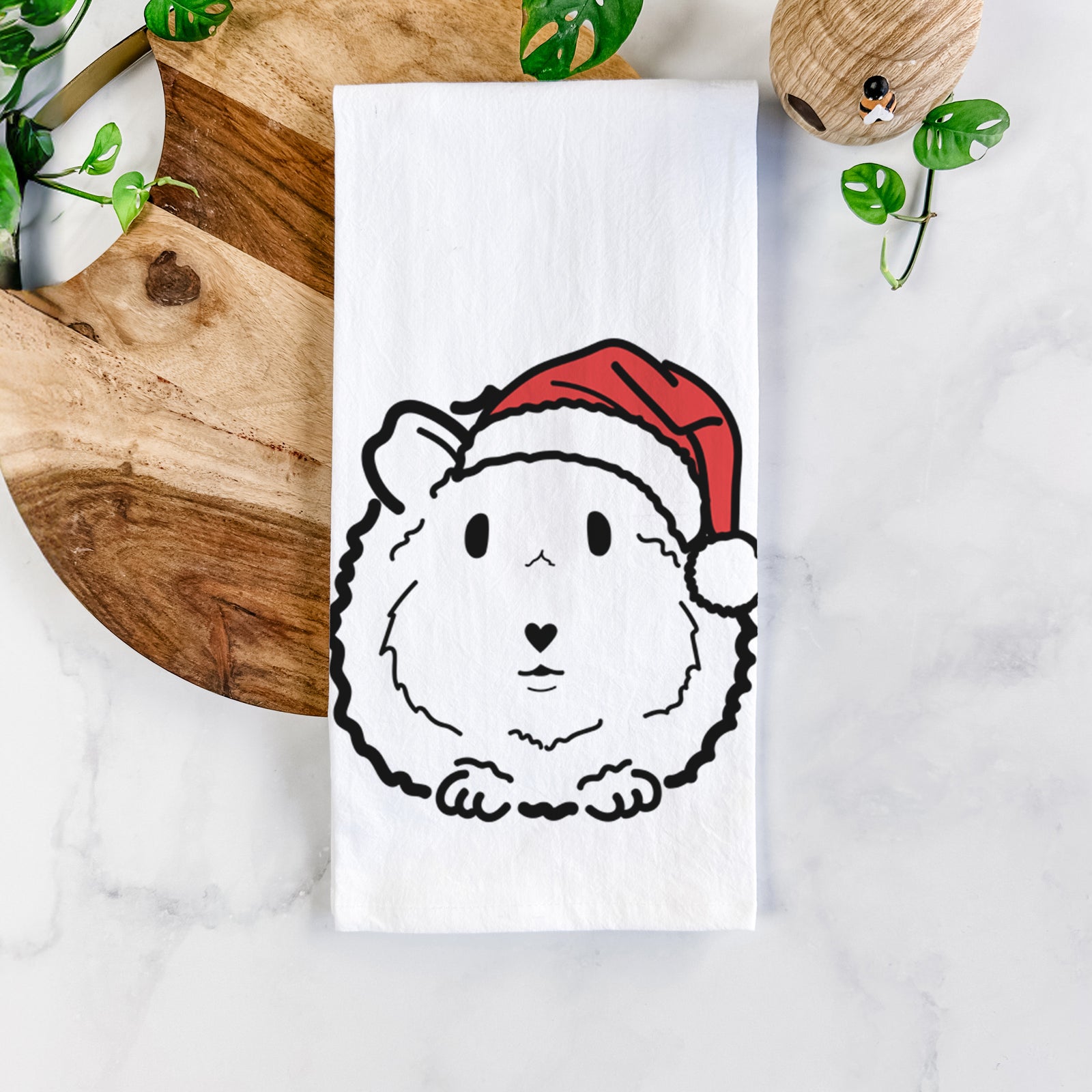 Minimalist line drawing of Duke the Guinea Pig wearing a Santa hat on a tea towel