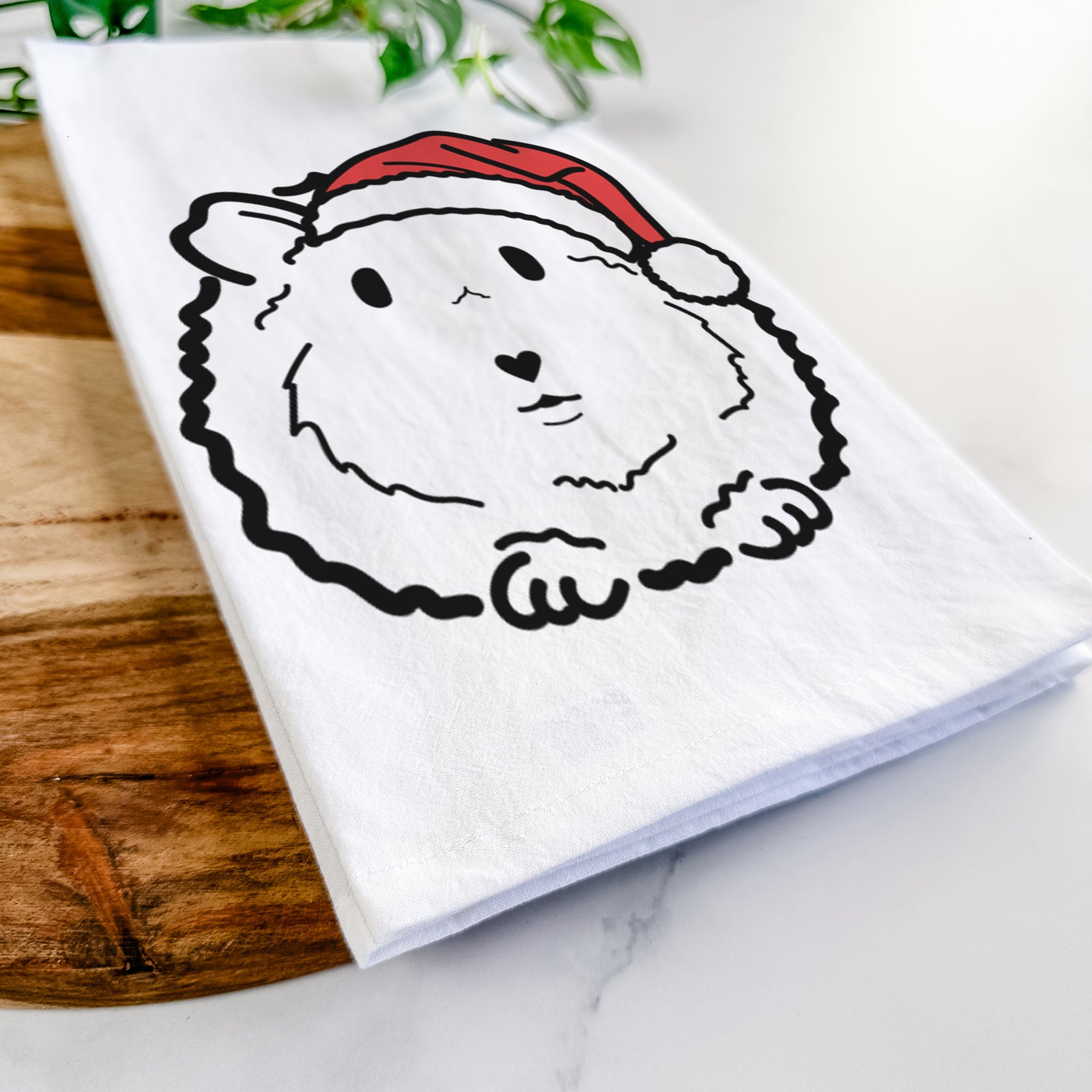 Minimalist line drawing of Duke the Guinea Pig wearing a Santa hat on a tea towel