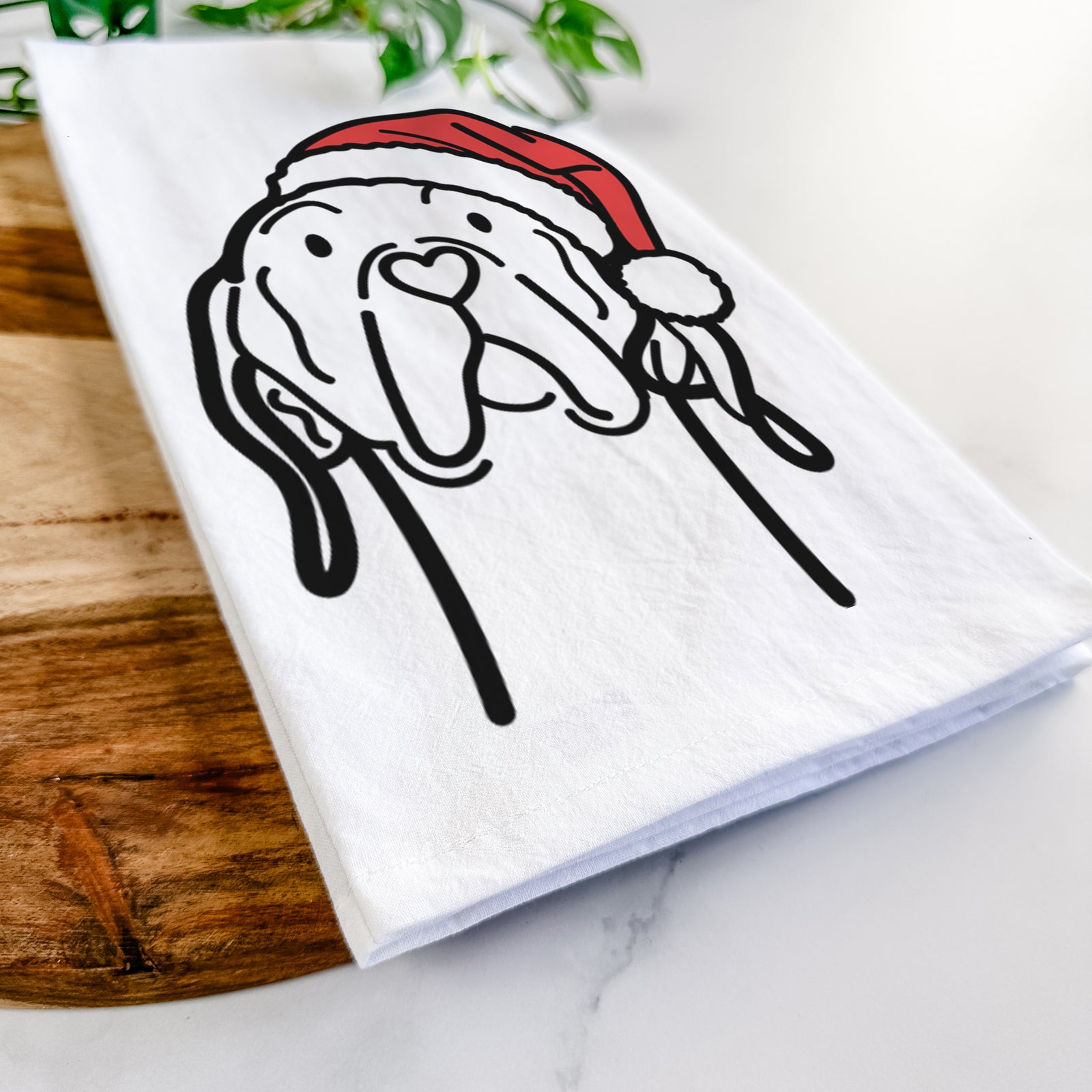Minimalist line drawing of an English Pointer wearing a Santa hat on a tea towel