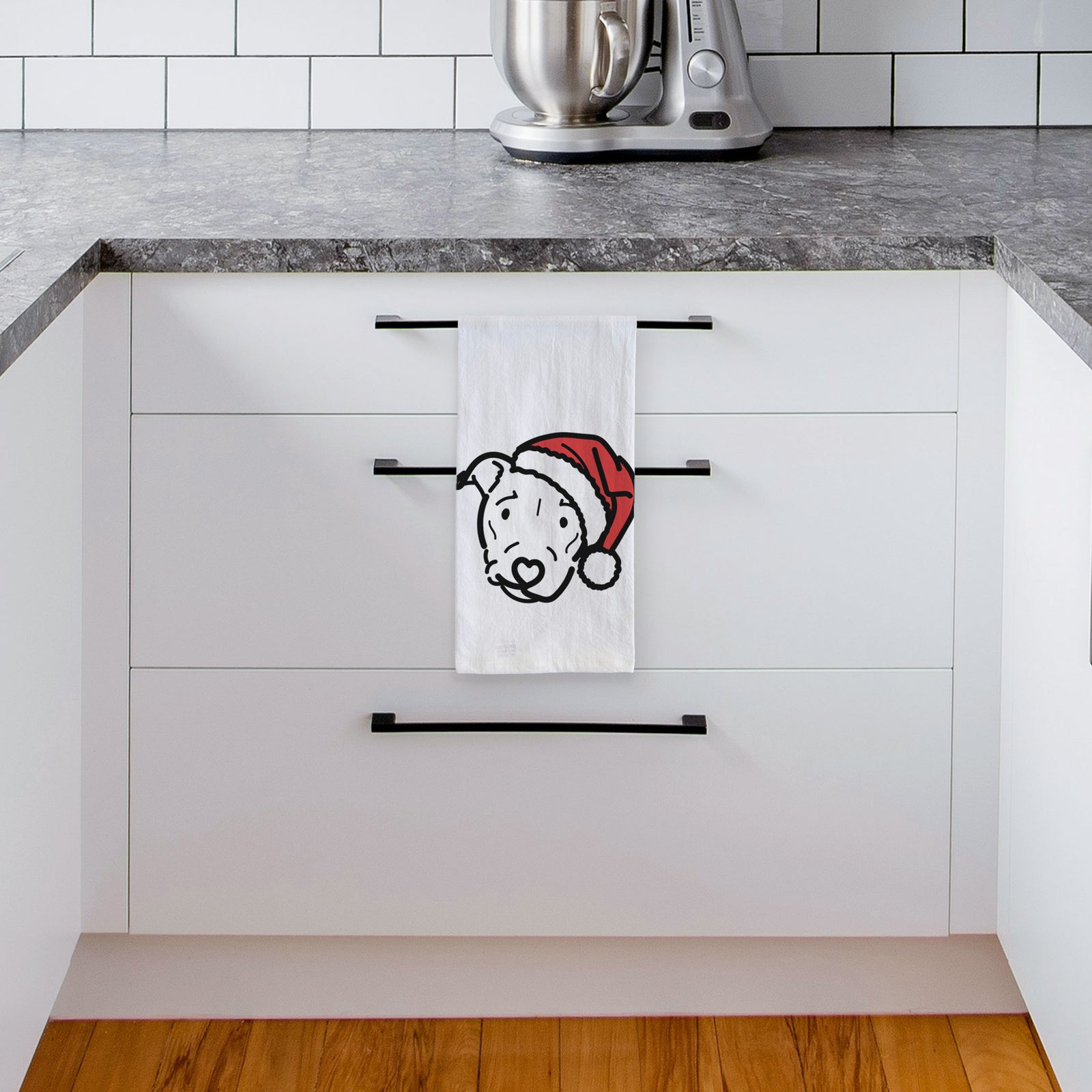 Minimalist line drawing of Ernie the Pitbull Mix wearing a Santa hat on a tea towel, hanging on an oven door in a kitchen