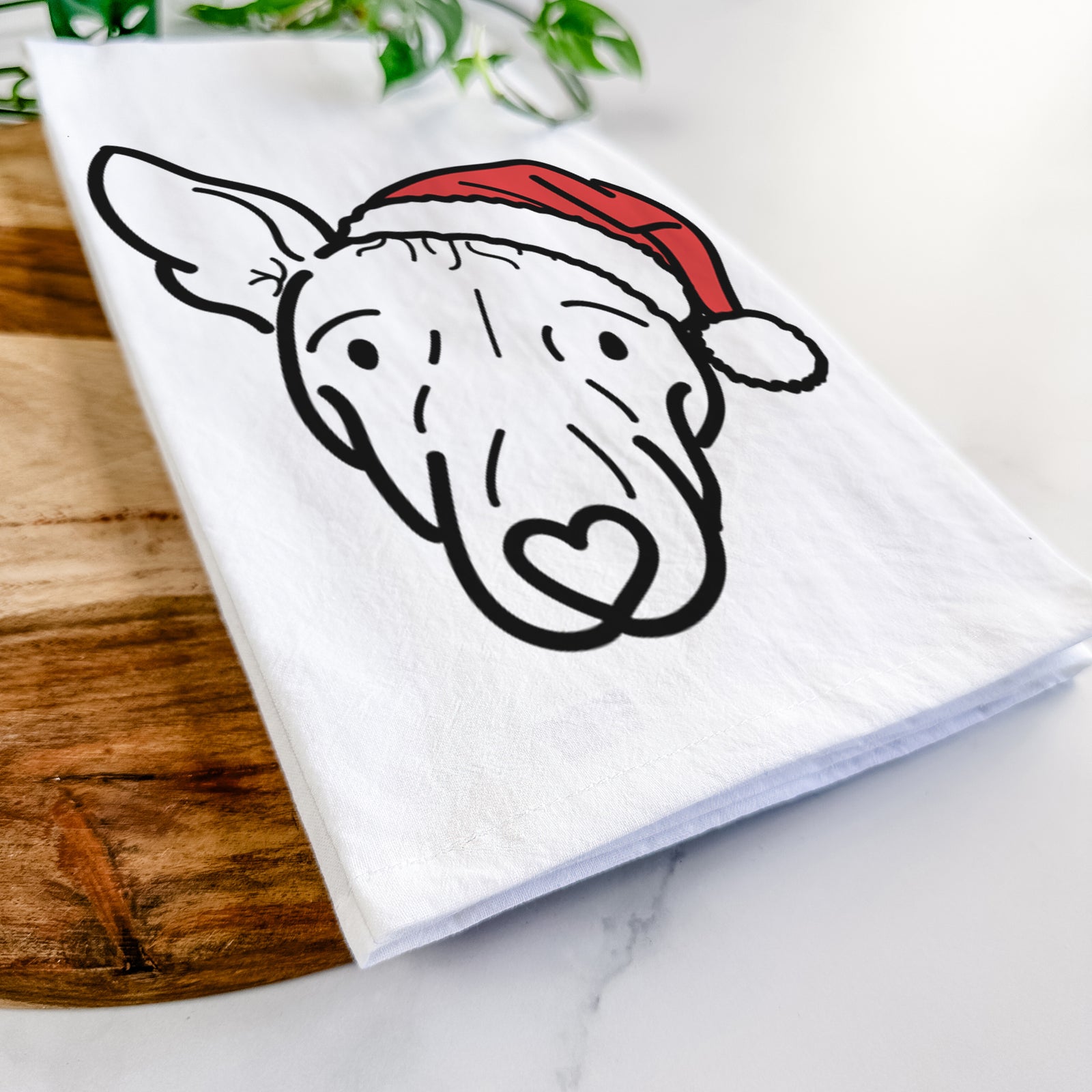 Minimalist line drawing of Georgia the American Hairless Terrier wearing a Santa hat on a tea towel