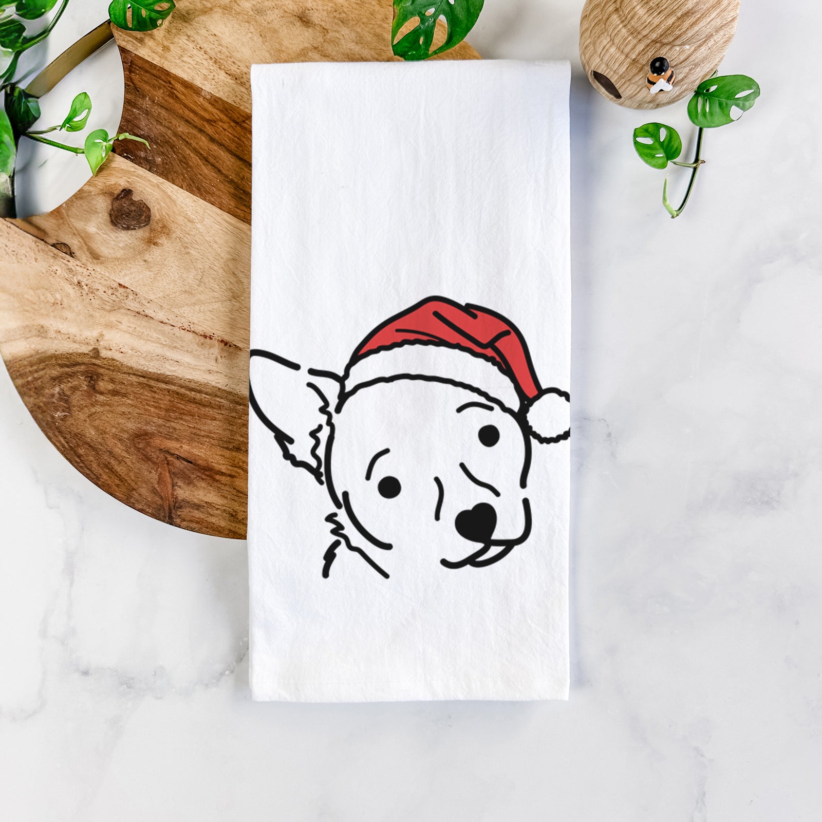 Minimalist line drawing of GiGi the Chihuahua Mix wearing a Santa hat on a tea towel