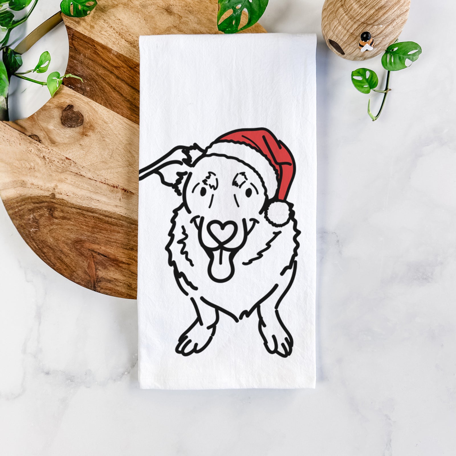 Minimalist line drawing of Gretchen the Basset Hound German Shepherd Mix wearing a Santa hat on a tea towel