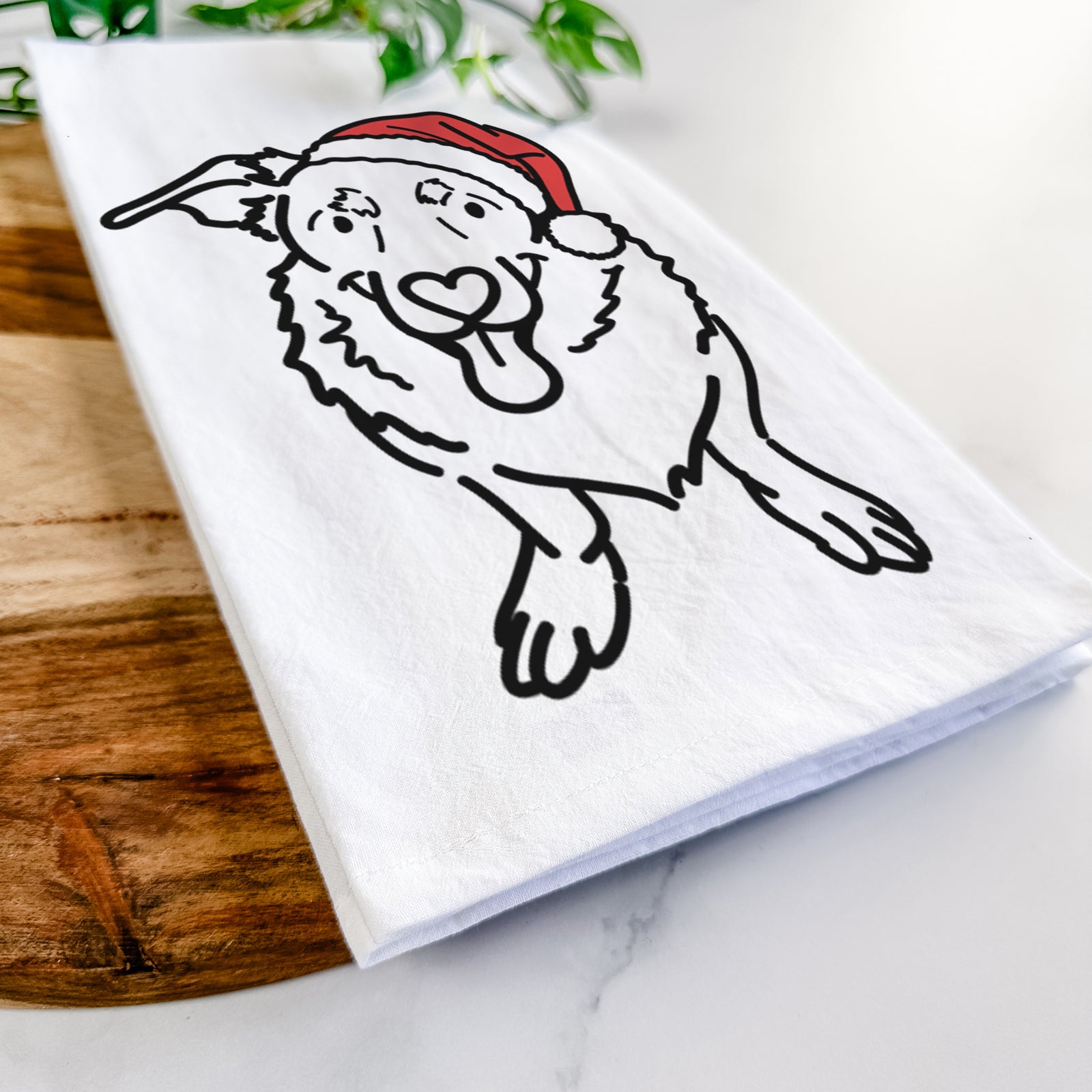 Minimalist line drawing of Gretchen the Basset Hound German Shepherd Mix wearing a Santa hat on a tea towel
