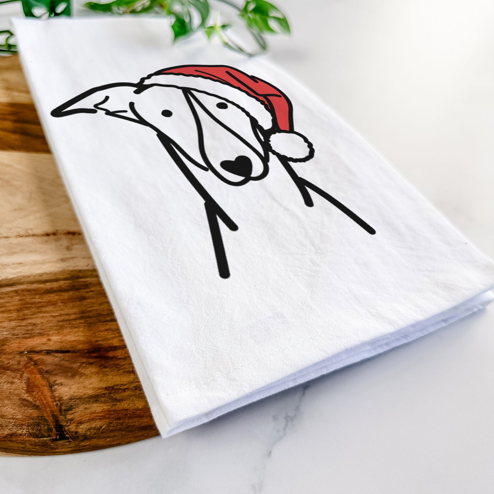 Minimalist line drawing of a Greyhound wearing a Santa hat on a tea towel