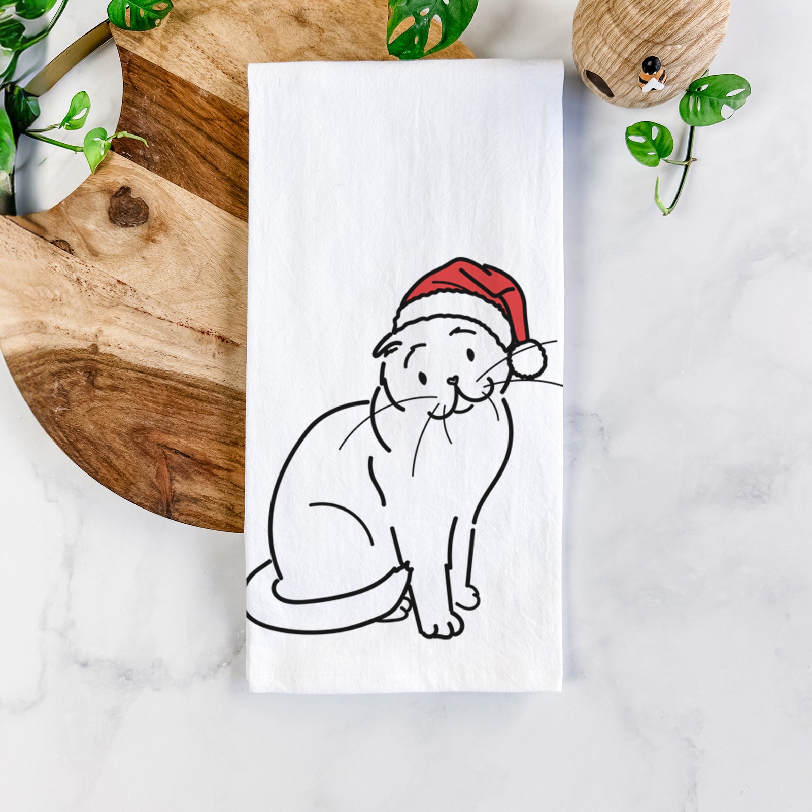 Minimalist line drawing of Hank the Scottish Fold Cat wearing a Santa hat on a tea towel