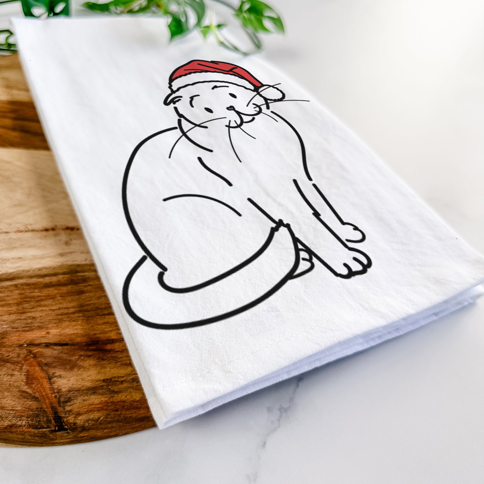 Minimalist line drawing of Hank the Scottish Fold Cat wearing a Santa hat on a tea towel