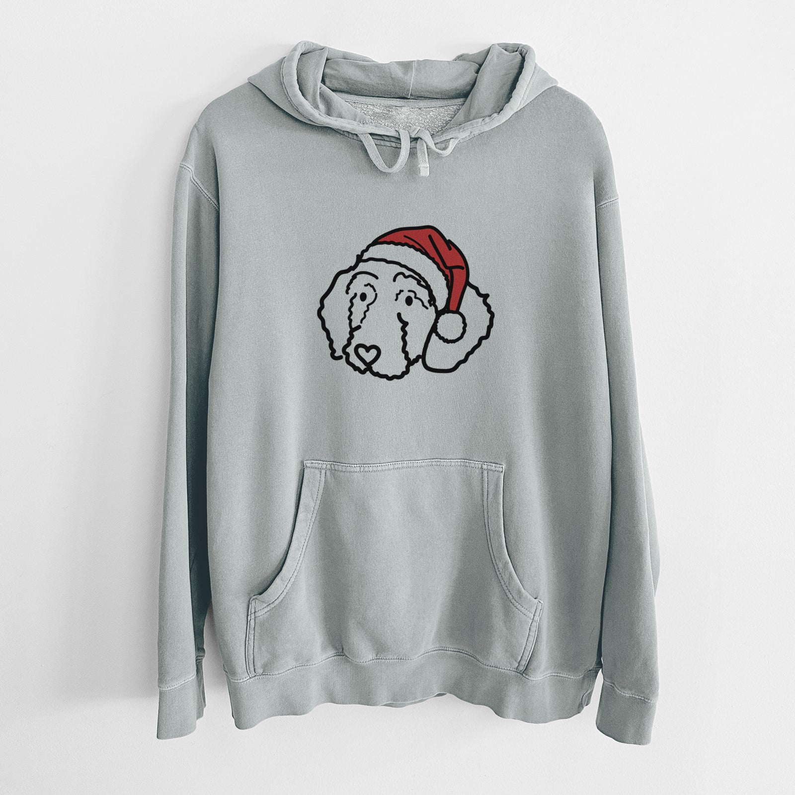 Minimalist line drawing of Hanna the Goldendoodle wearing a Santa hat on a Sage Unisex pigment dyed hoodie