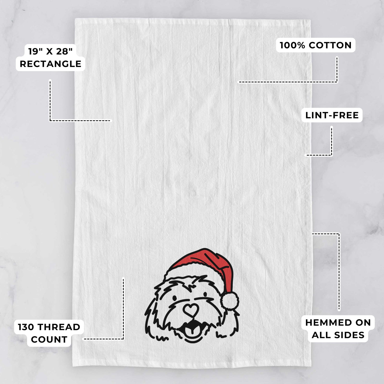 Minimalist line drawing of Harry the Cavachon wearing a Santa hat on a tea towel, with feature callouts: 19 x 28 inch rectangle, 100% cotton, lint-free, 120 thread count, hemmed on all sides