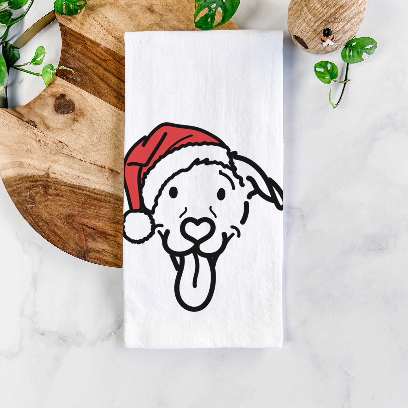 Minimalist line drawing of Hemi the Pitbull Mix wearing a Santa hat on a tea towel