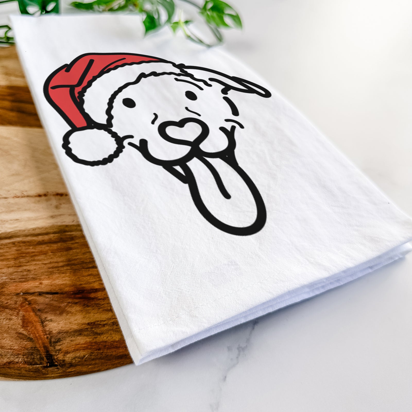 Minimalist line drawing of Hemi the Pitbull Mix wearing a Santa hat on a tea towel