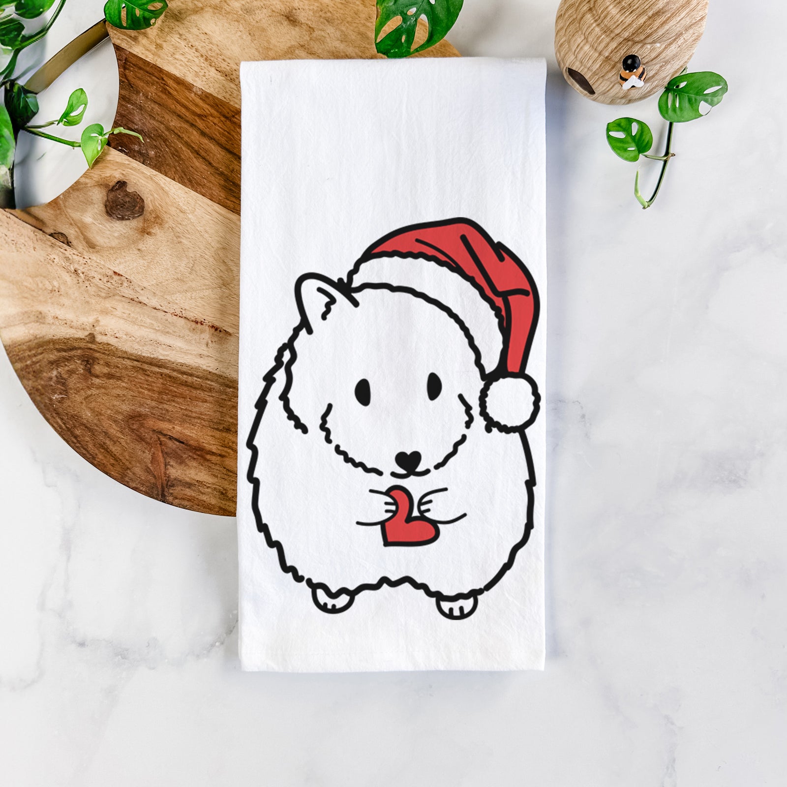 Minimalist line drawing of Hilga the Hamster wearing a Santa hat on a tea towel