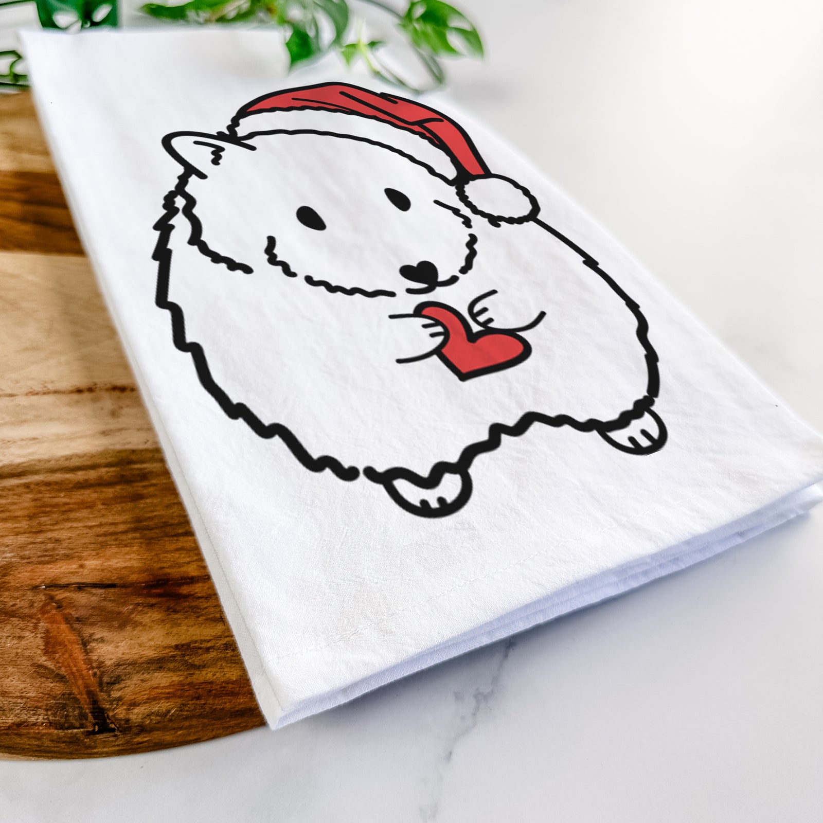 Minimalist line drawing of Hilga the Hamster wearing a Santa hat on a tea towel