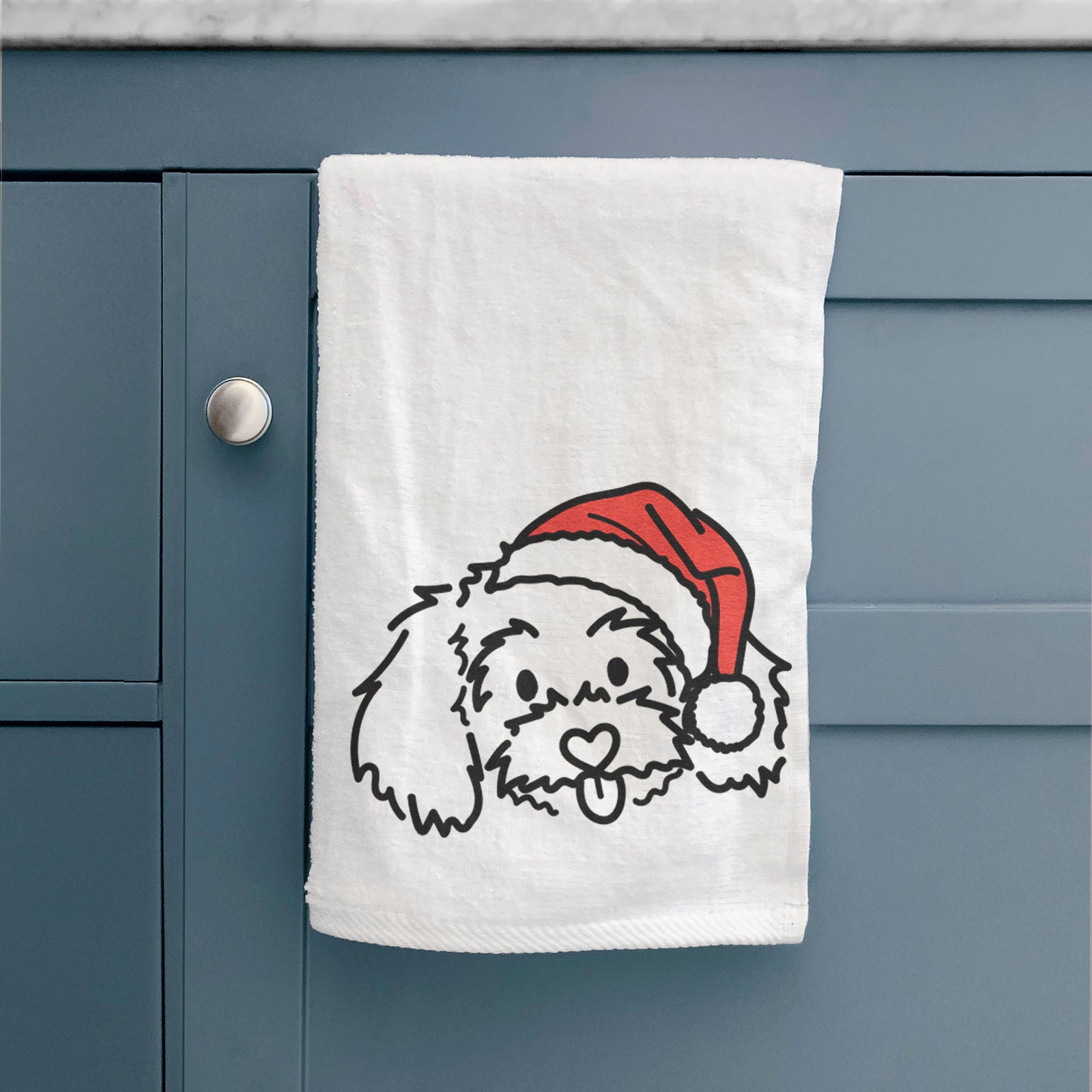 Minimalist line drawing of Holly the Maltipoo wearing a Santa hat on a decorative hand towel