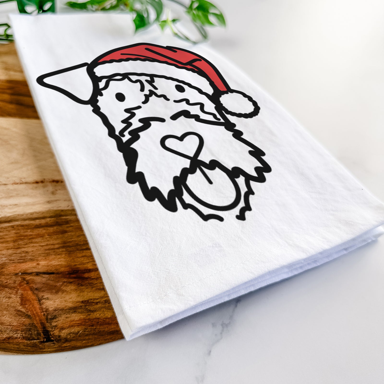 Minimalist line drawing of an Irish Terrier wearing a Santa hat on a tea towel
