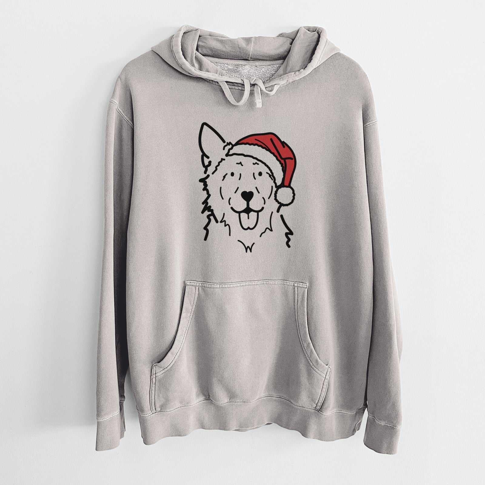 Minimalist line drawing of Jack the Mudi wearing a Santa hat on a Cement Unisex pigment dyed hoodie
