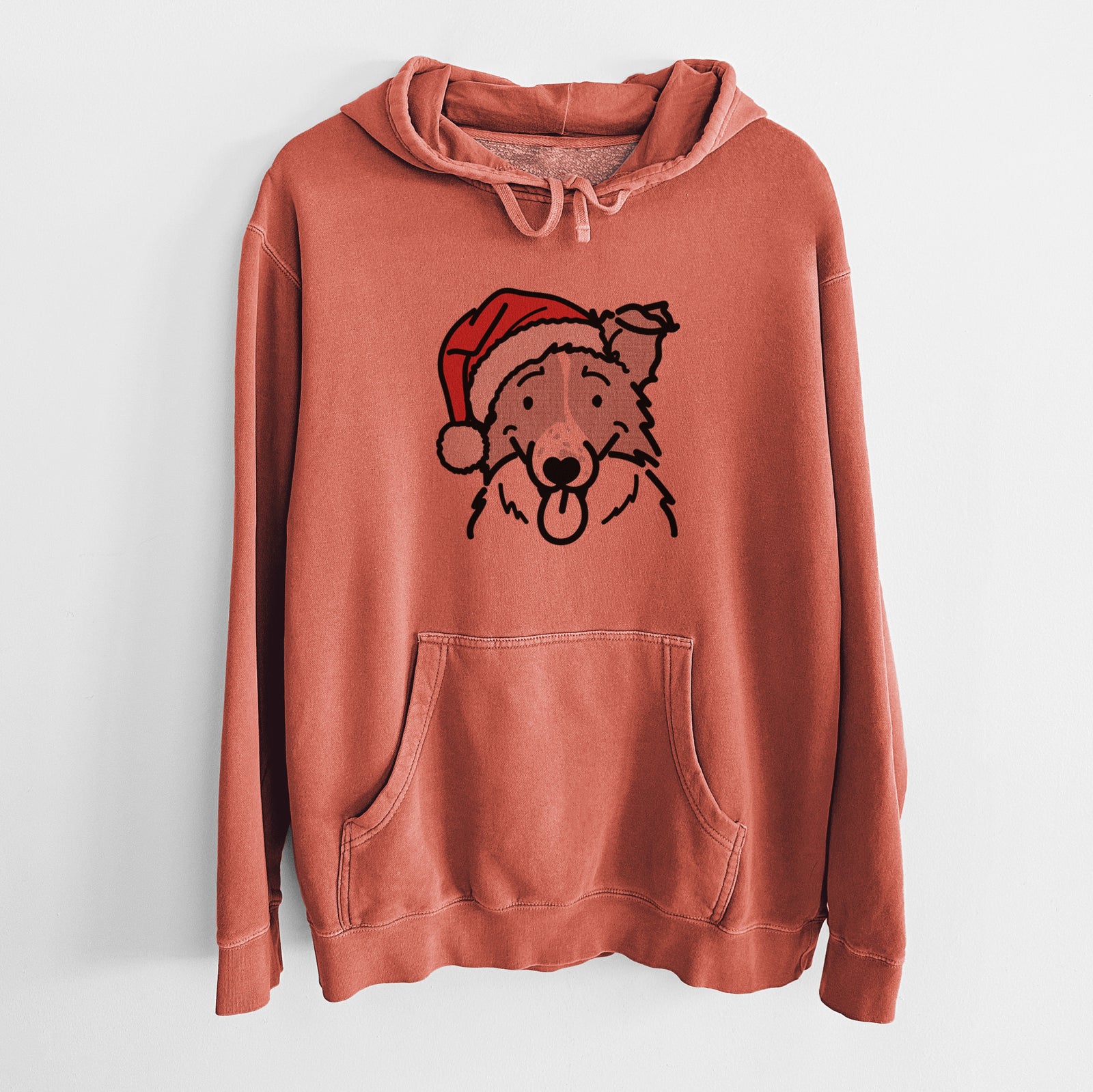 Minimalist line drawing of Jam the Border Collie wearing a Santa hat on an Amber Unisex pigment dyed hoodie