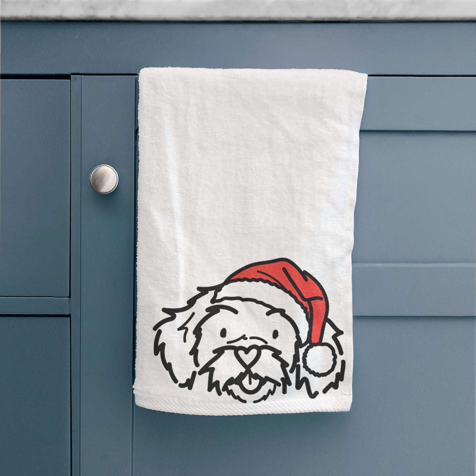 Minimalist line drawing of Jo Jo the Peekapoo wearing a Santa hat on a hand towel