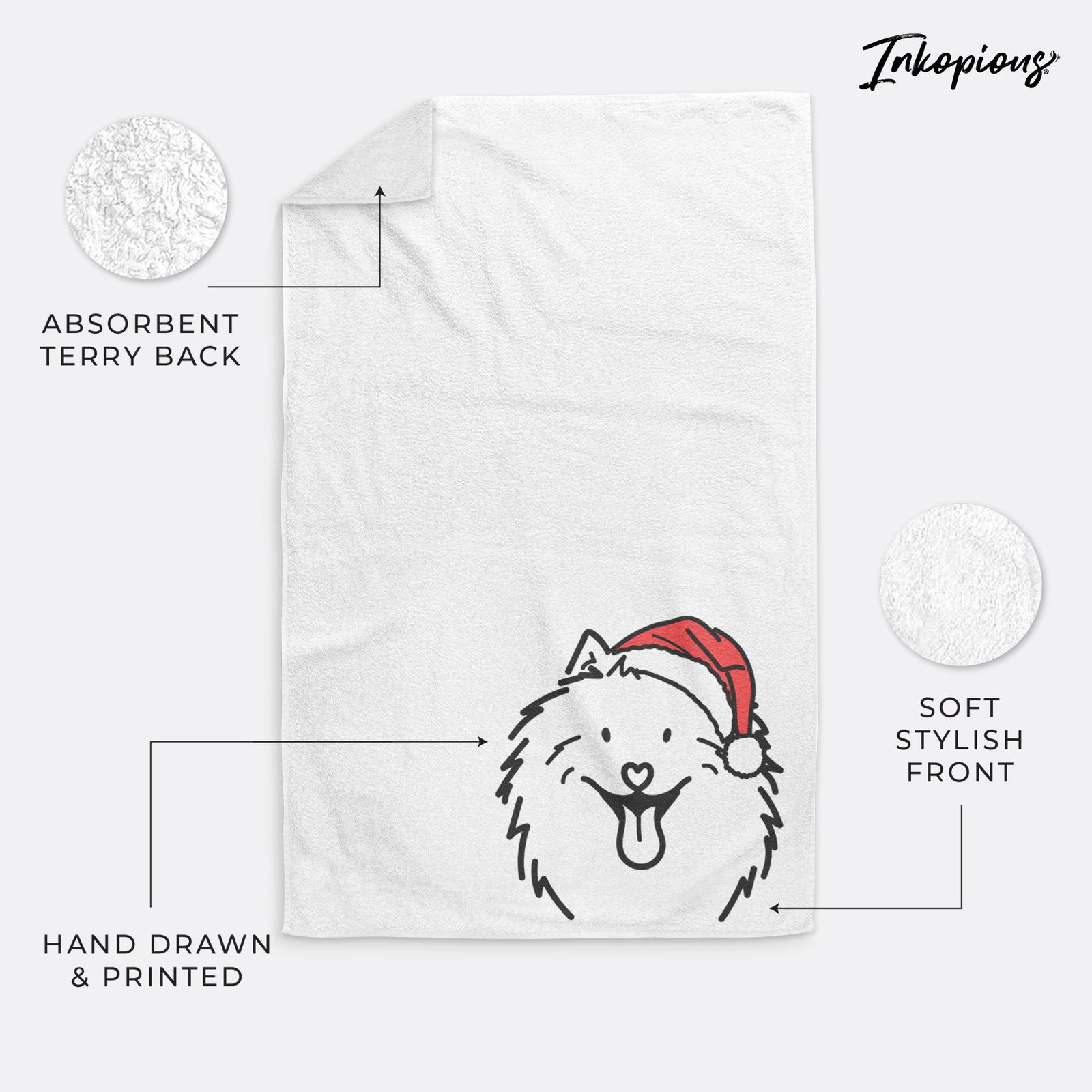 Minimalist line drawing of Johnny the Samoyed wearing a Santa hat on a hand towel