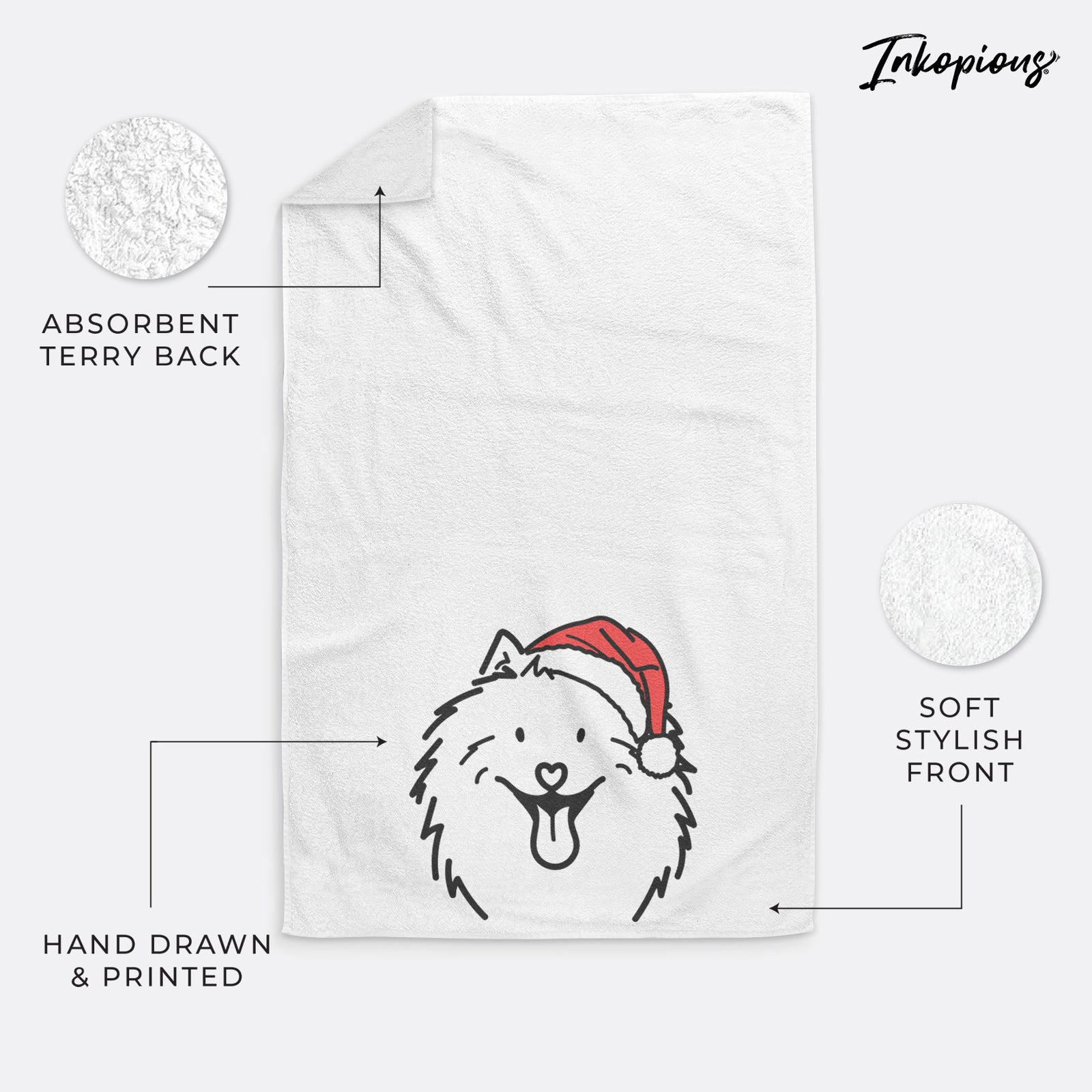 Minimalist line drawing of Johnny the Samoyed wearing a Santa hat on a hand towel