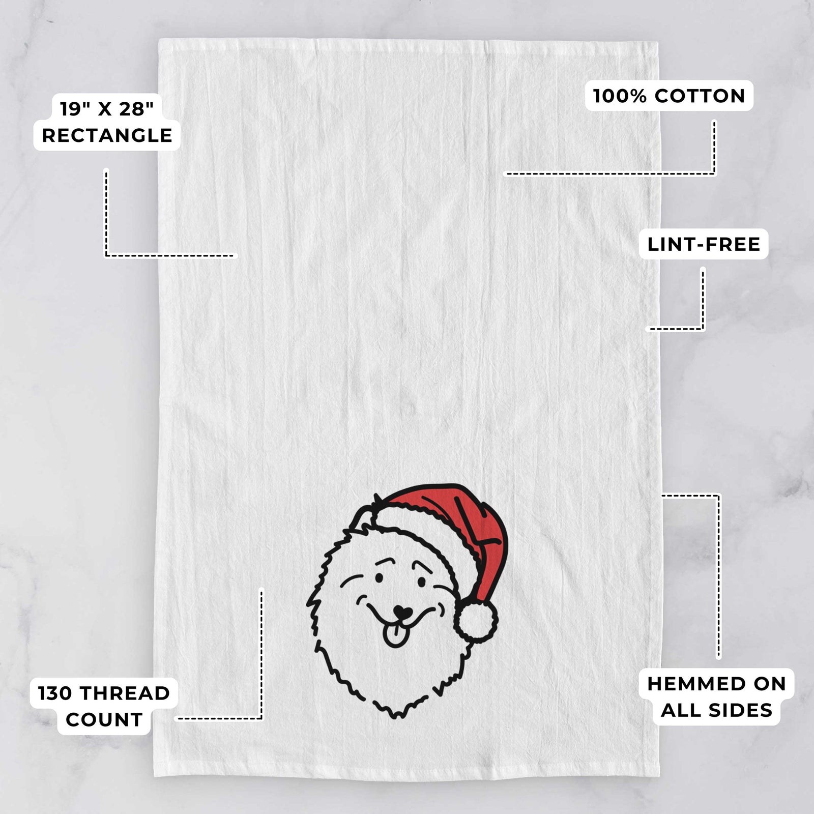 Minimalist line drawing of a Keeshond wearing a Santa hat on a tea towel, with feature callouts: 19 x 28 inch rectangle, 100% cotton, lint-free, 120 thread count, hemmed on all sides