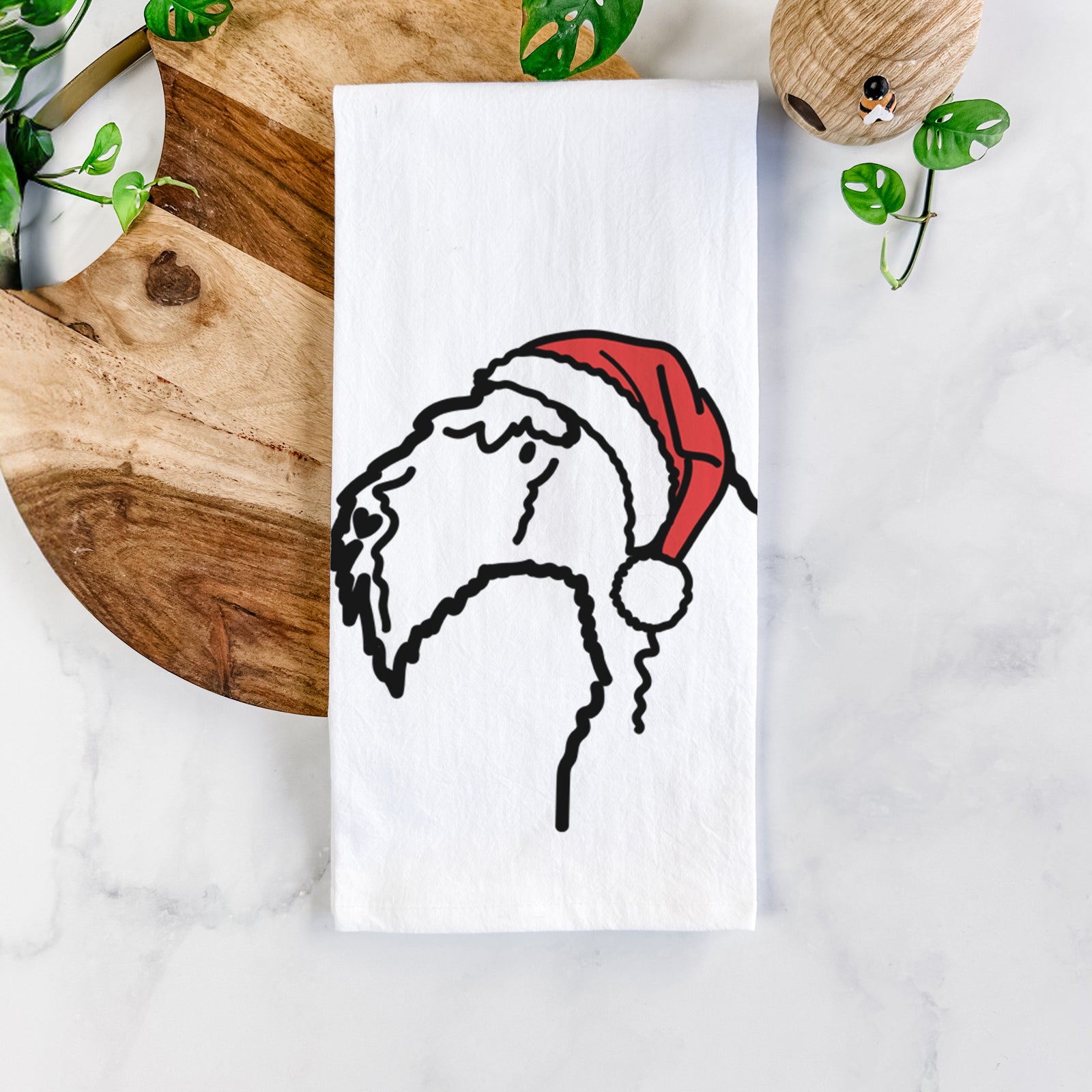 Minimalist line drawing of a Kerry Blue Terrier wearing a Santa hat on a tea towel