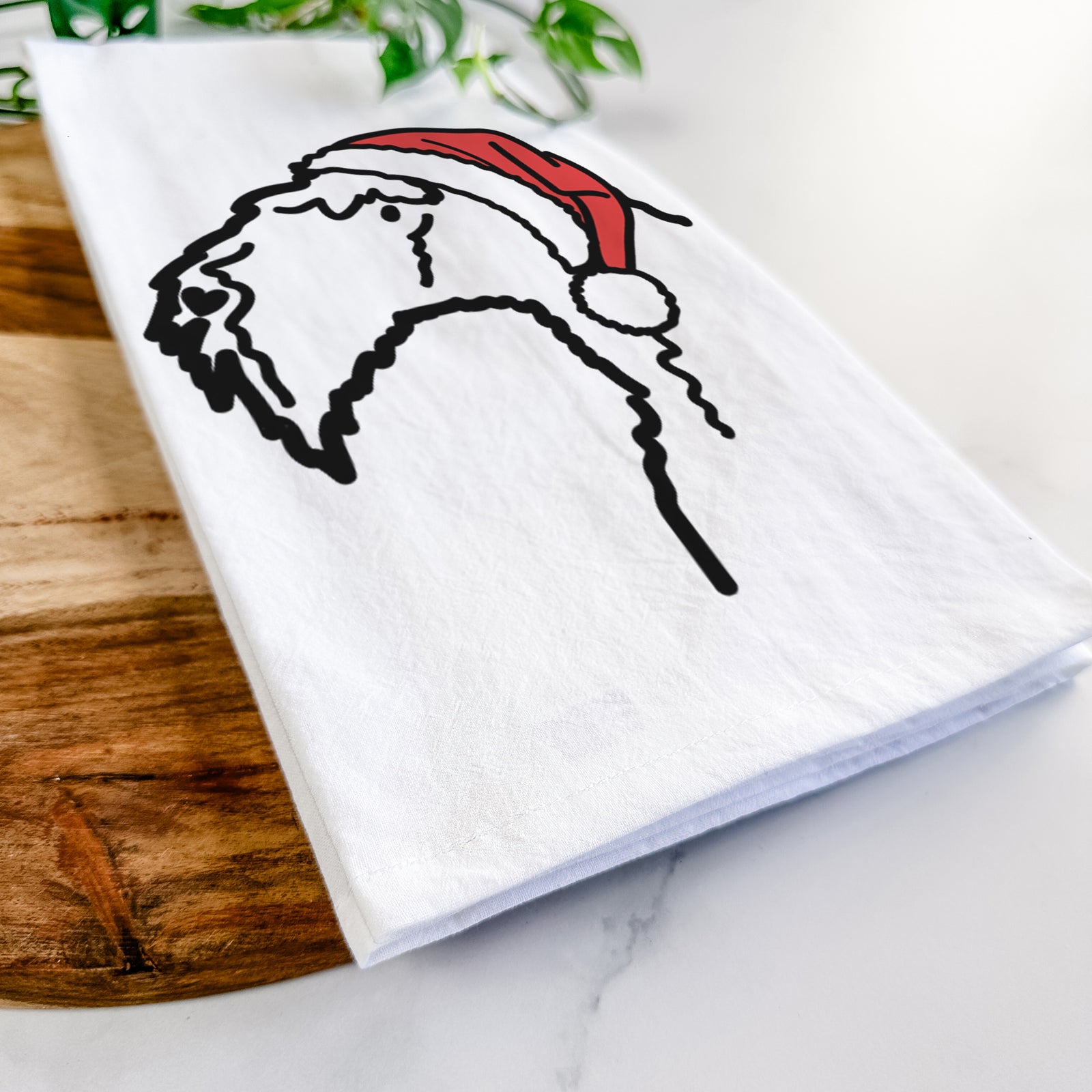 Minimalist line drawing of a Kerry Blue Terrier wearing a Santa hat on a tea towel