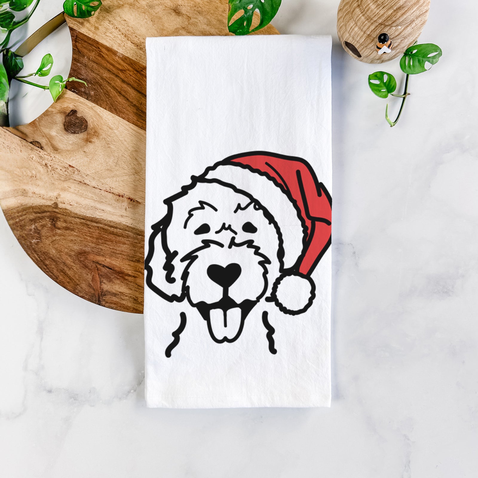 Minimalist line drawing of a Labradoodle wearing a Santa hat on a tea towel