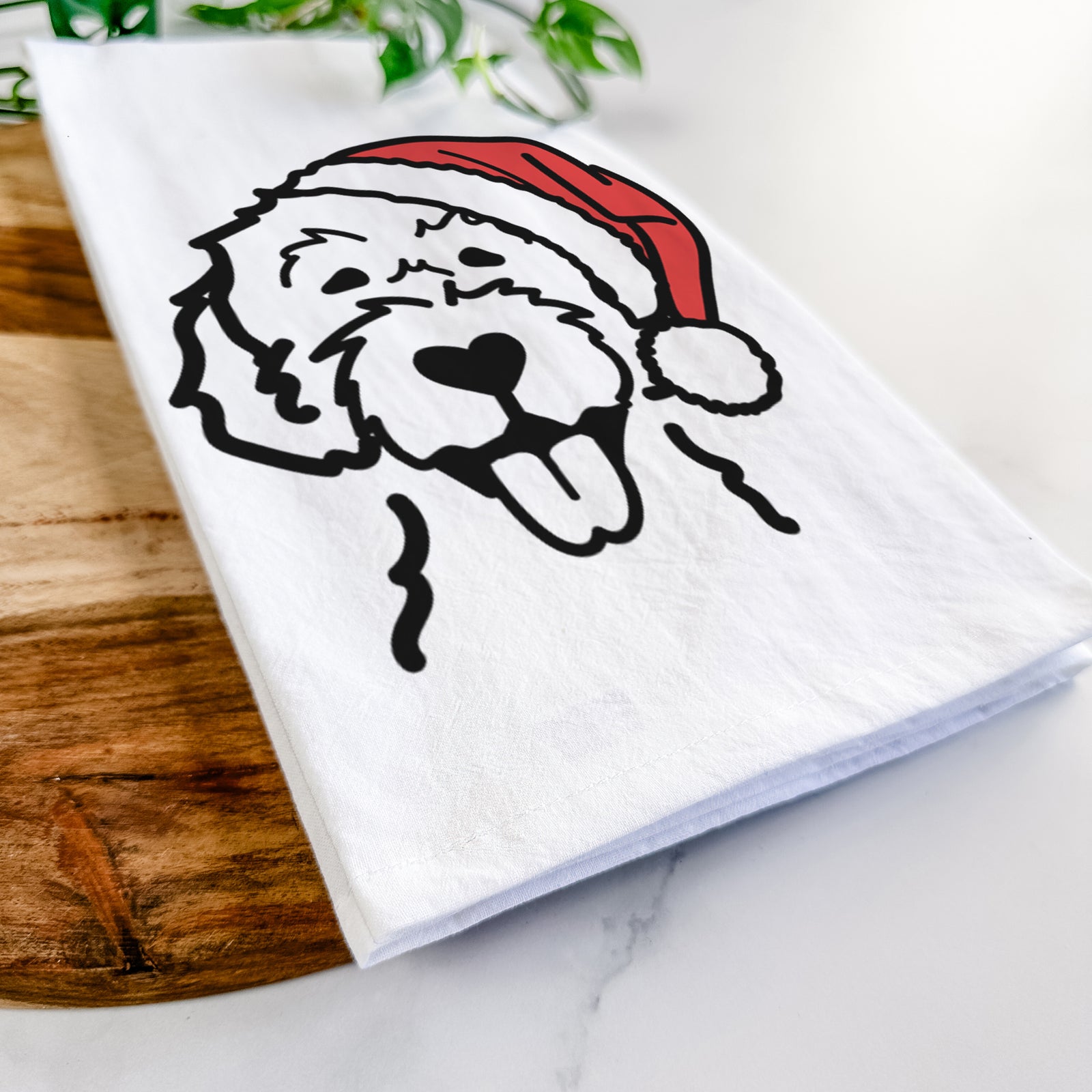 Minimalist line drawing of a Labradoodle wearing a Santa hat on a tea towel
