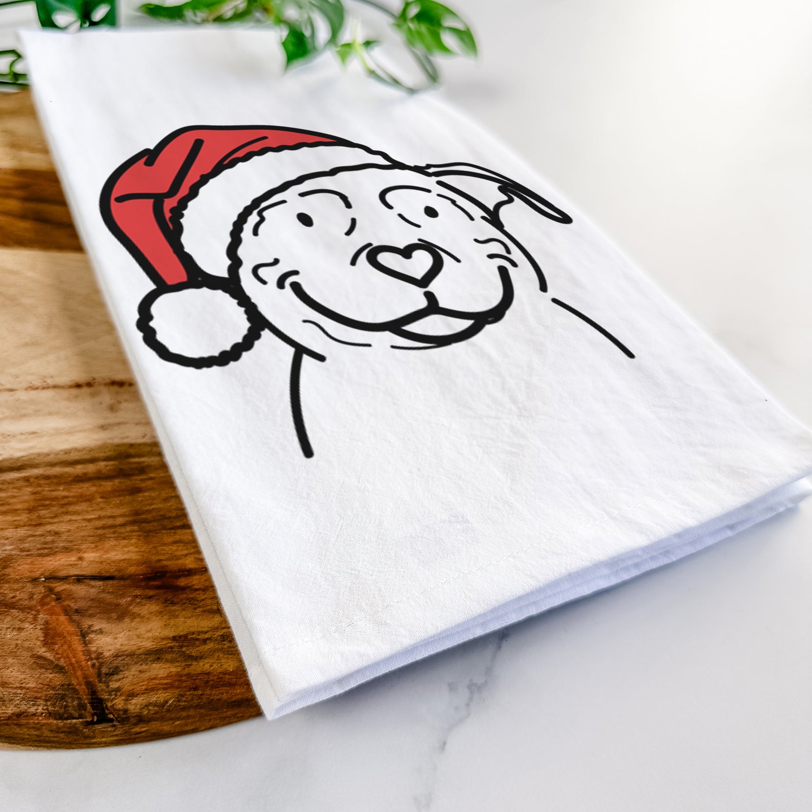 Minimalist line drawing of Lady the American Pitbull Terrier wearing a Santa hat on a tea towel