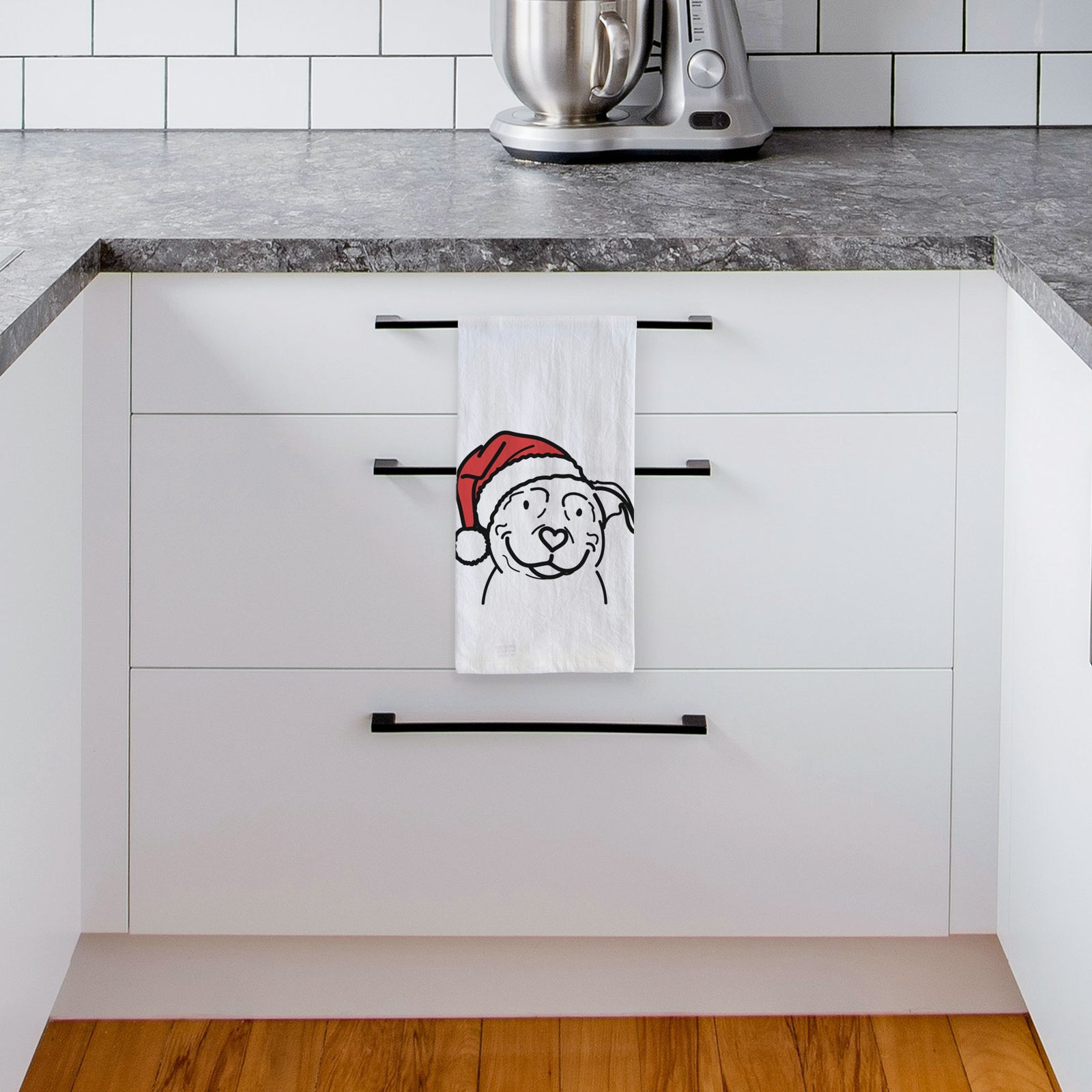 Minimalist line drawing of Lady the American Pitbull Terrier wearing a Santa hat on a tea towel, hanging on an oven door in a kitchen