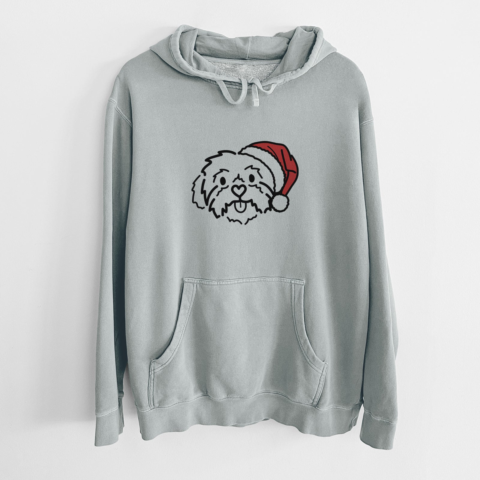 Minimalist line drawing of Leo the Shih Tzu wearing a Santa hat on a Sage Unisex pigment dyed hoodie