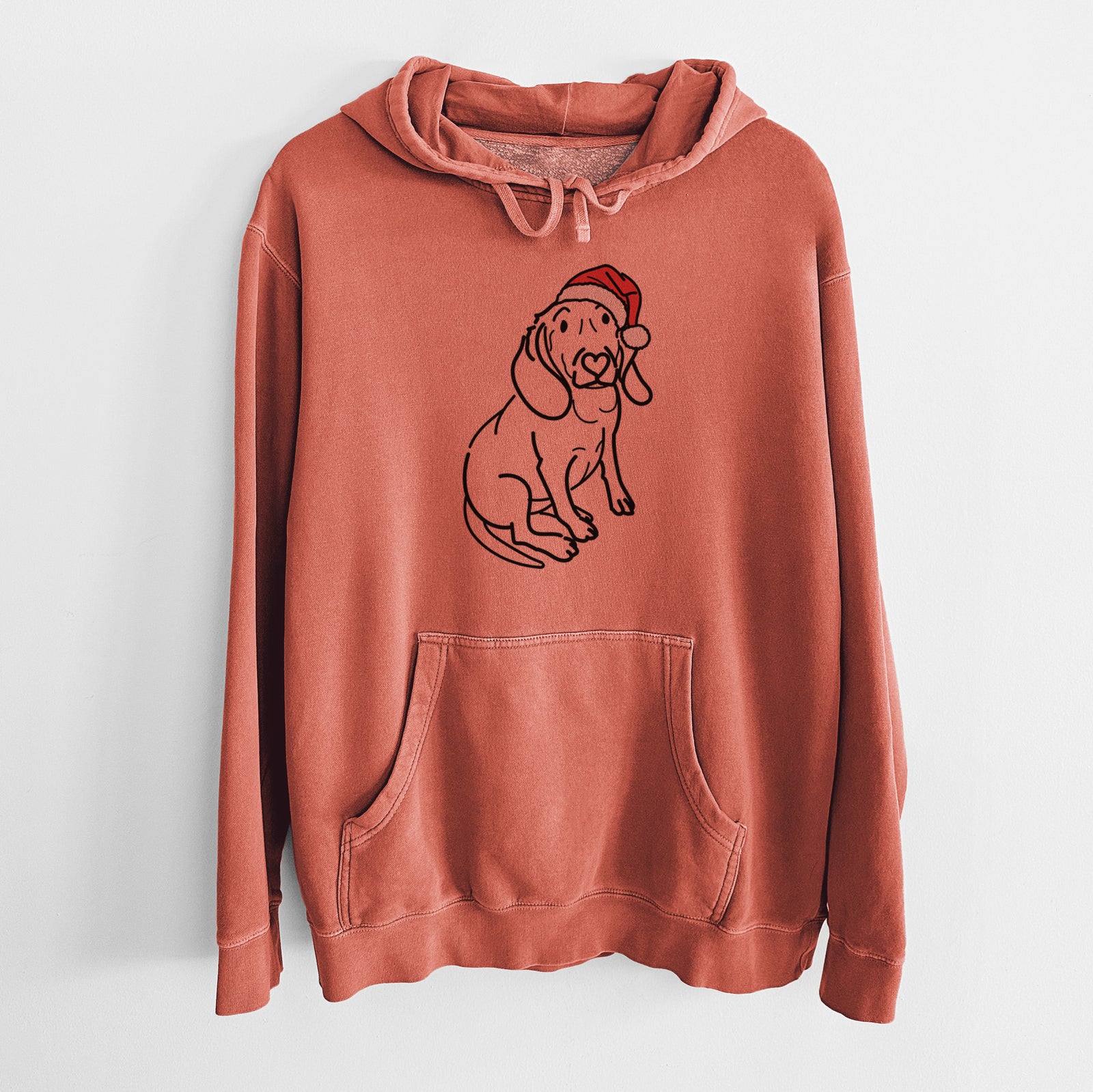 Minimalist line drawing of Lilly the Beagle wearing a Santa hat on an Amber Unisex pigment dyed hoodie