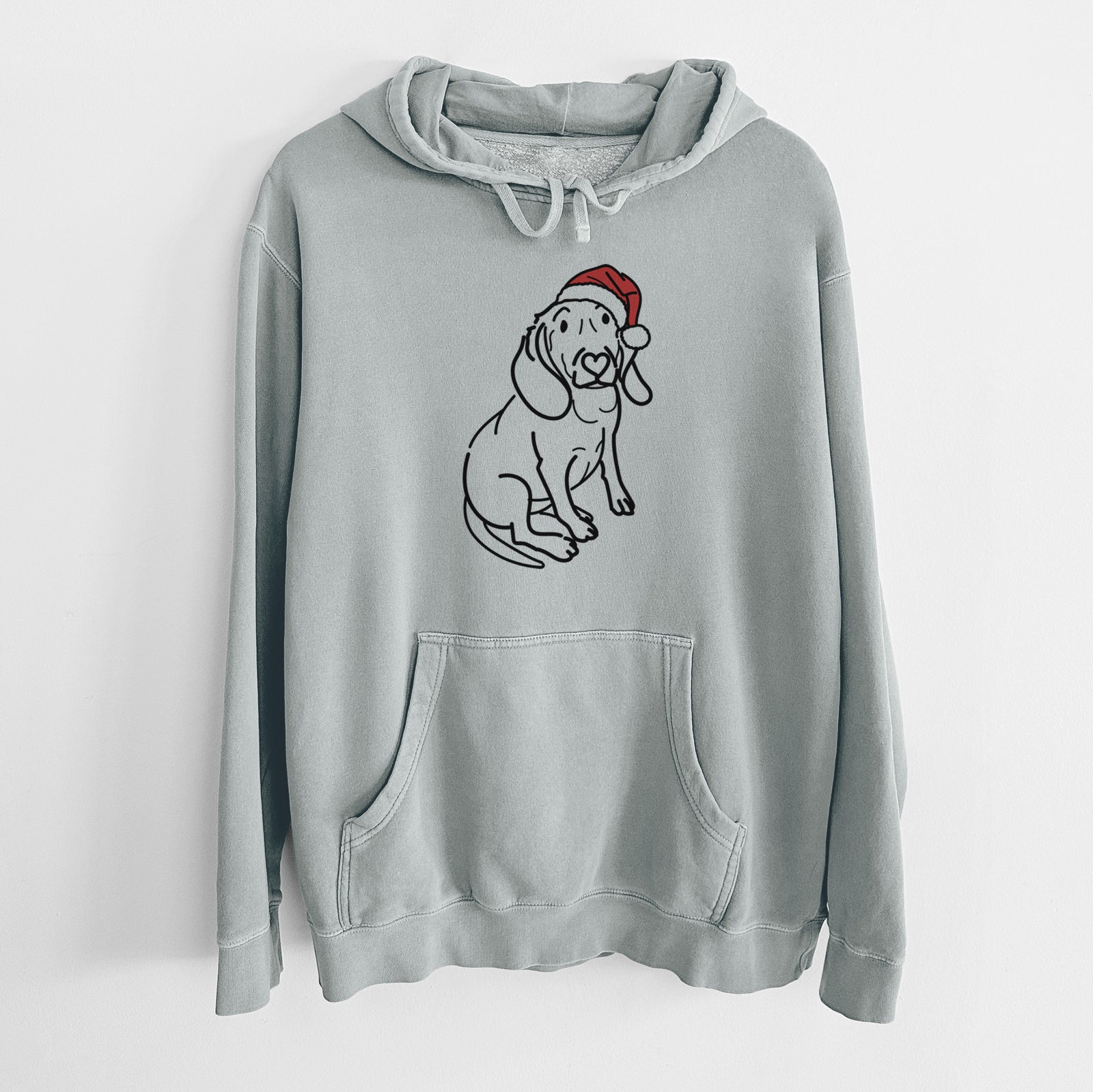 Minimalist line drawing of Lilly the Beagle wearing a Santa hat on a Sage Unisex pigment dyed hoodie