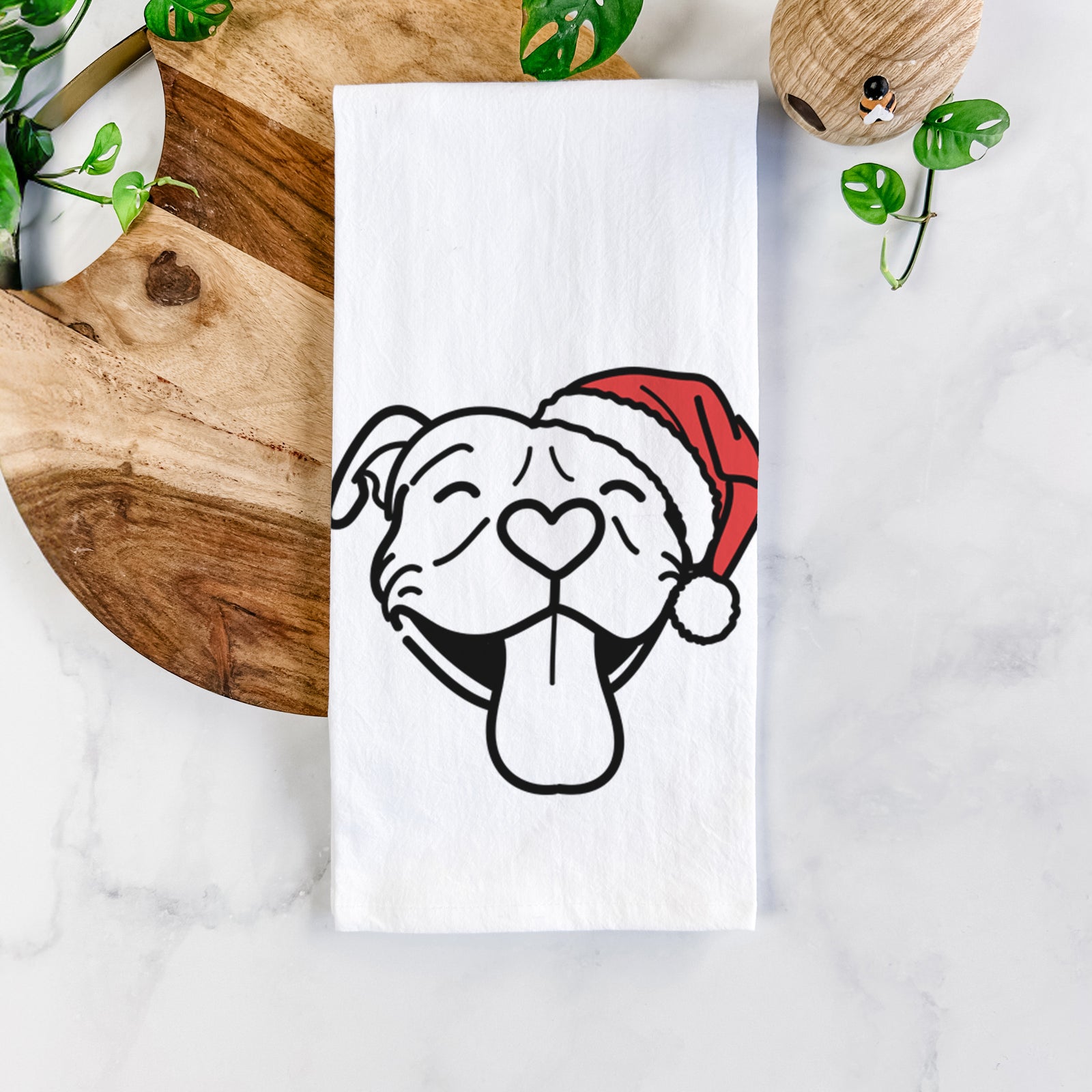 Minimalist line drawing of Louie the Pitbull wearing a Santa hat on a tea towel