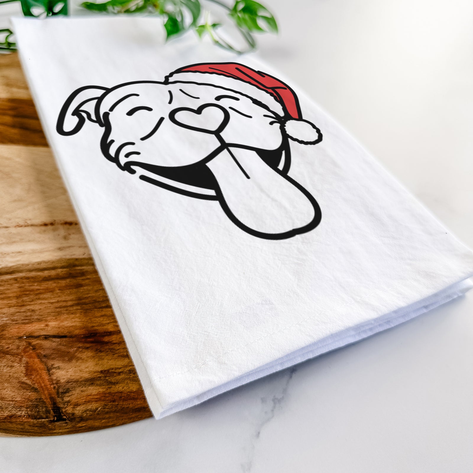 Minimalist line drawing of Louie the Pitbull wearing a Santa hat on a tea towel