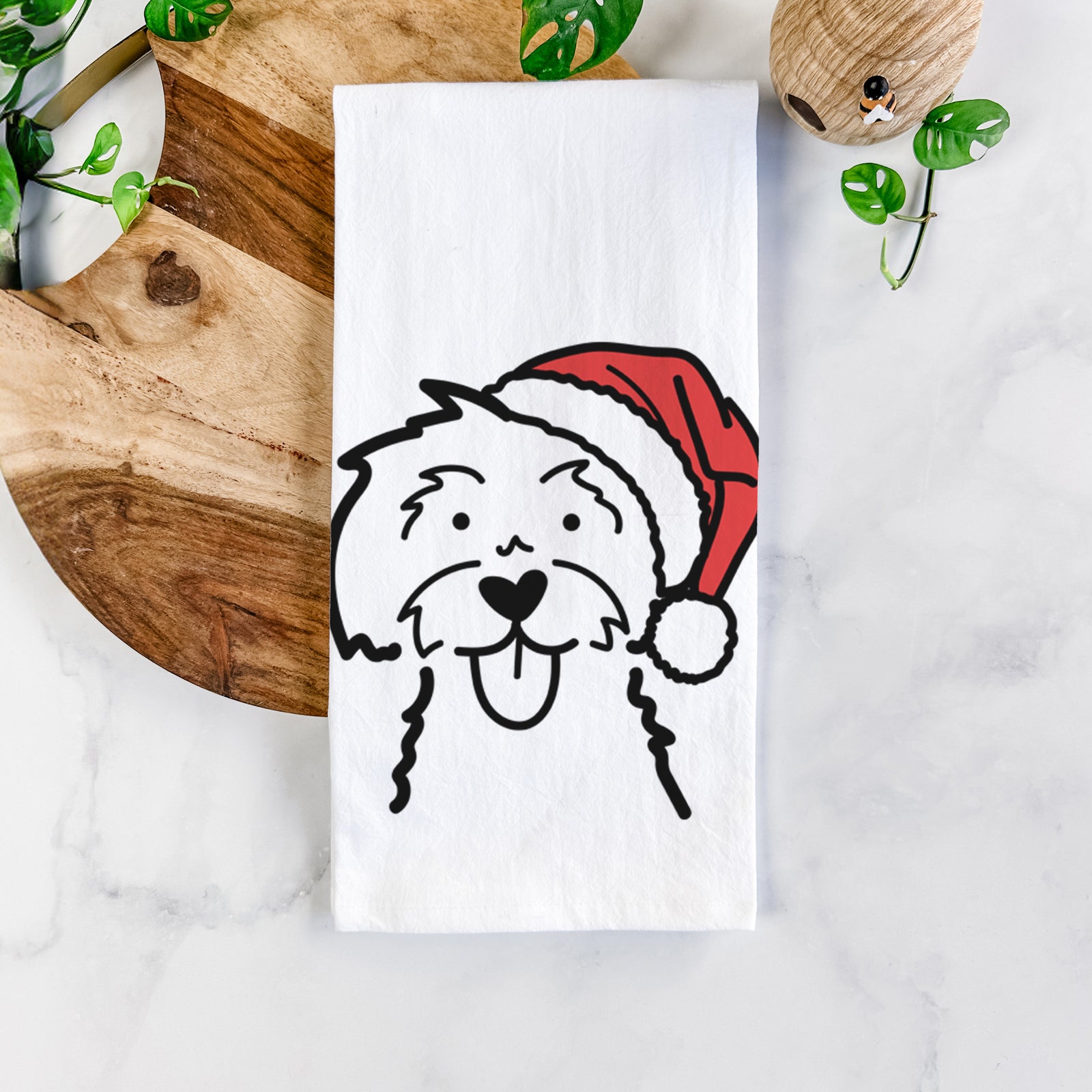 Minimalist line drawing of a Maltese wearing a Santa hat on a tea towel