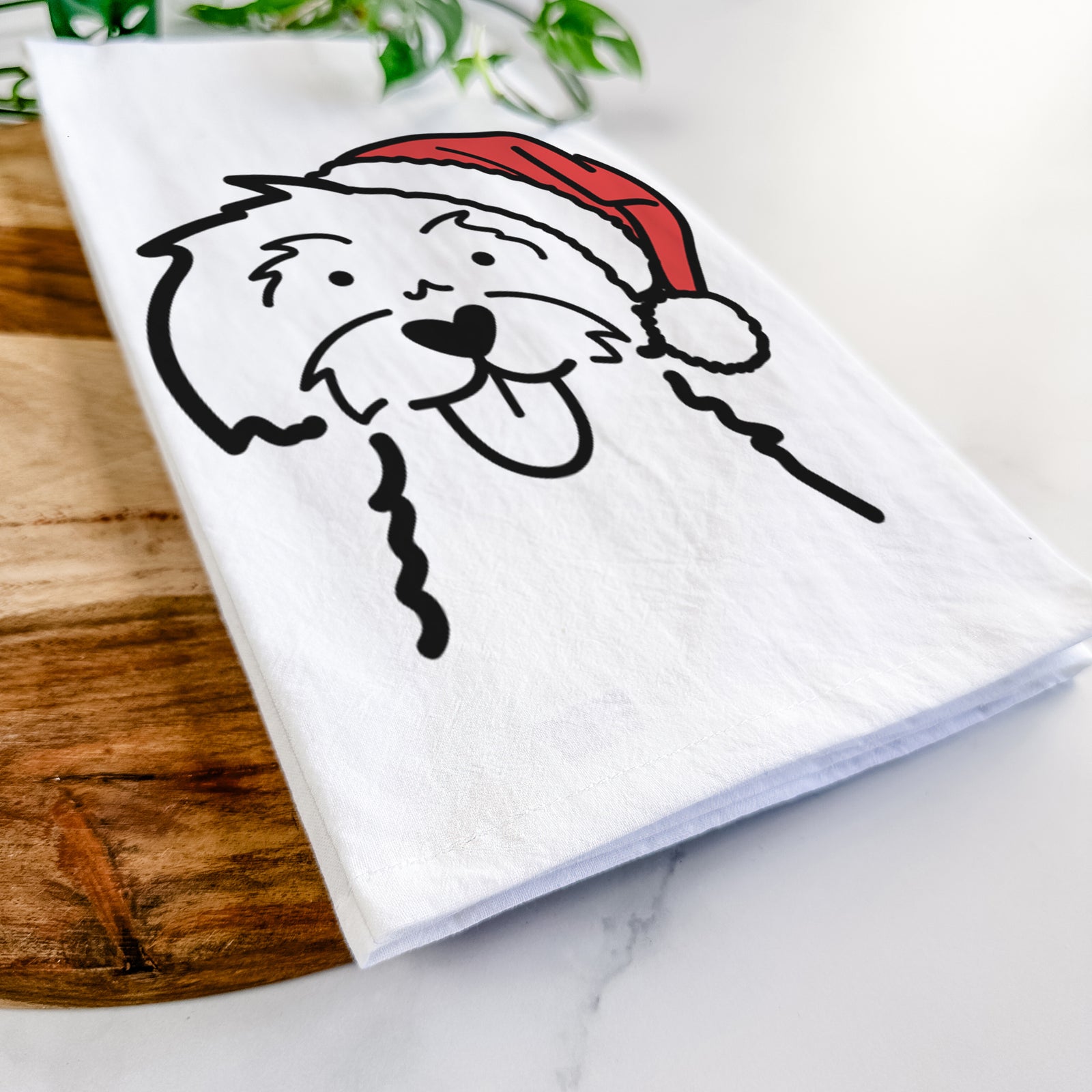 Minimalist line drawing of a Maltese wearing a Santa hat on a tea towel