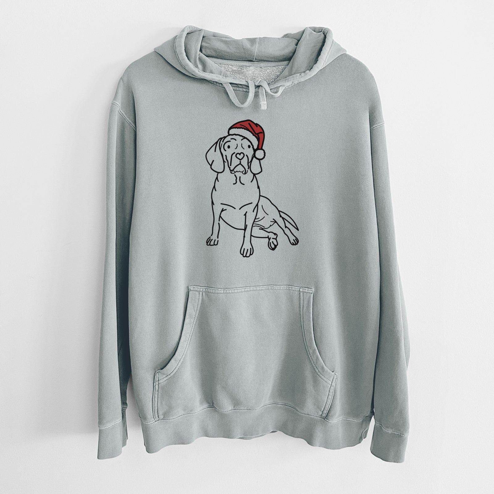 Minimalist line drawing of Mayble the Puggle wearing a Santa hat on a Sage Unisex pigment dyed hoodie