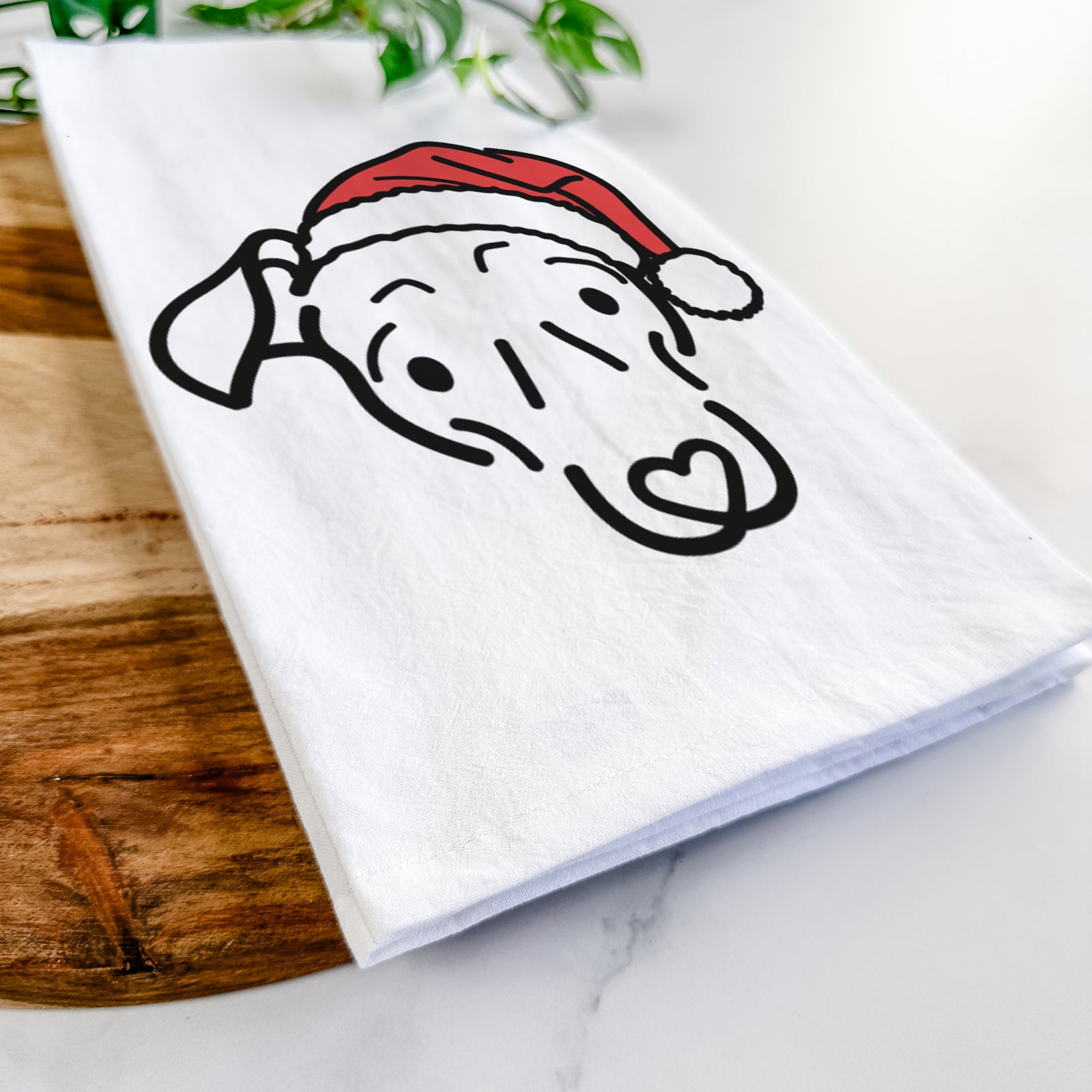 Minimalist line drawing of Millie the Mixed Breed wearing a Santa hat on a tea towel