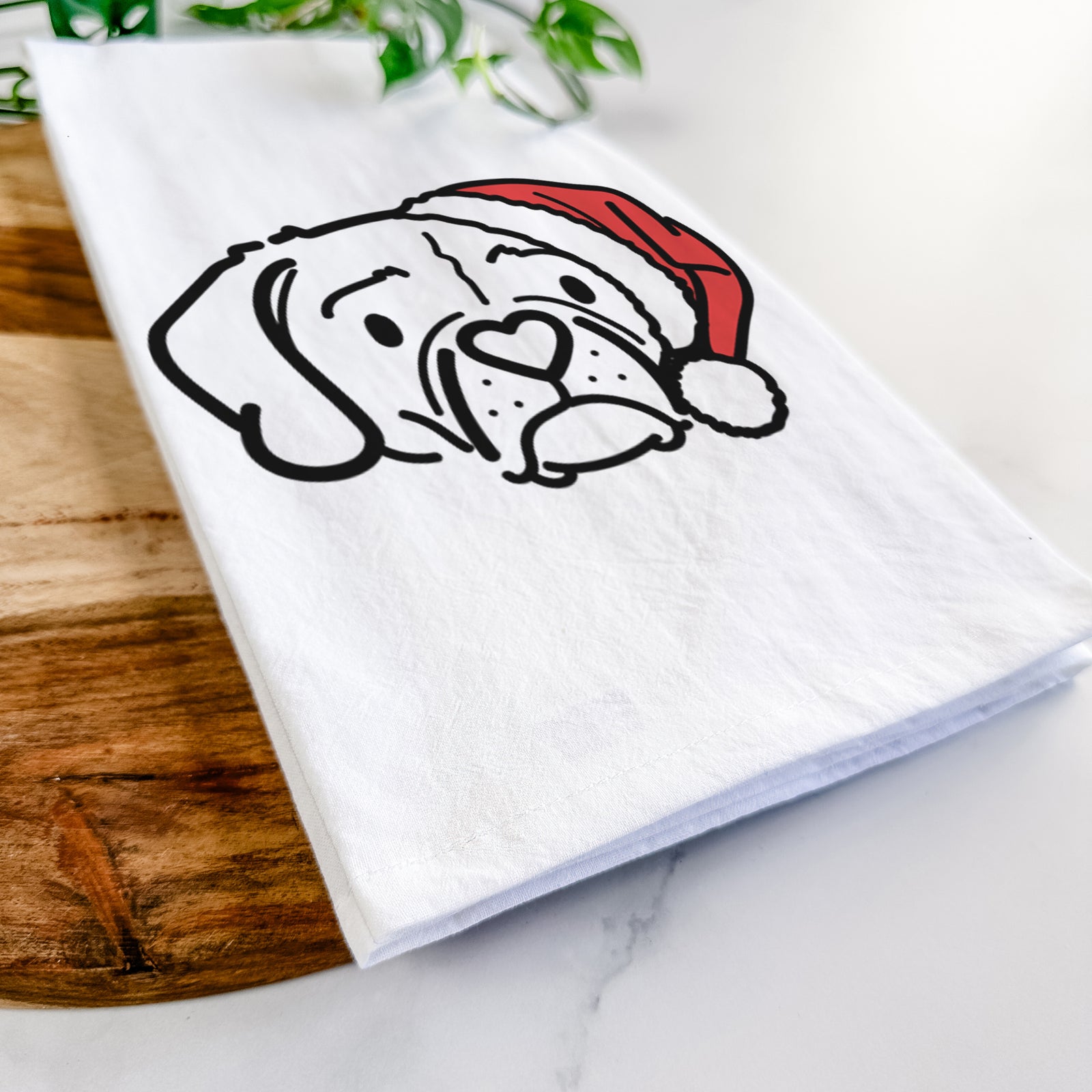 Minimalist line drawing of Mitzi the Puggle wearing a Santa hat on a tea towel