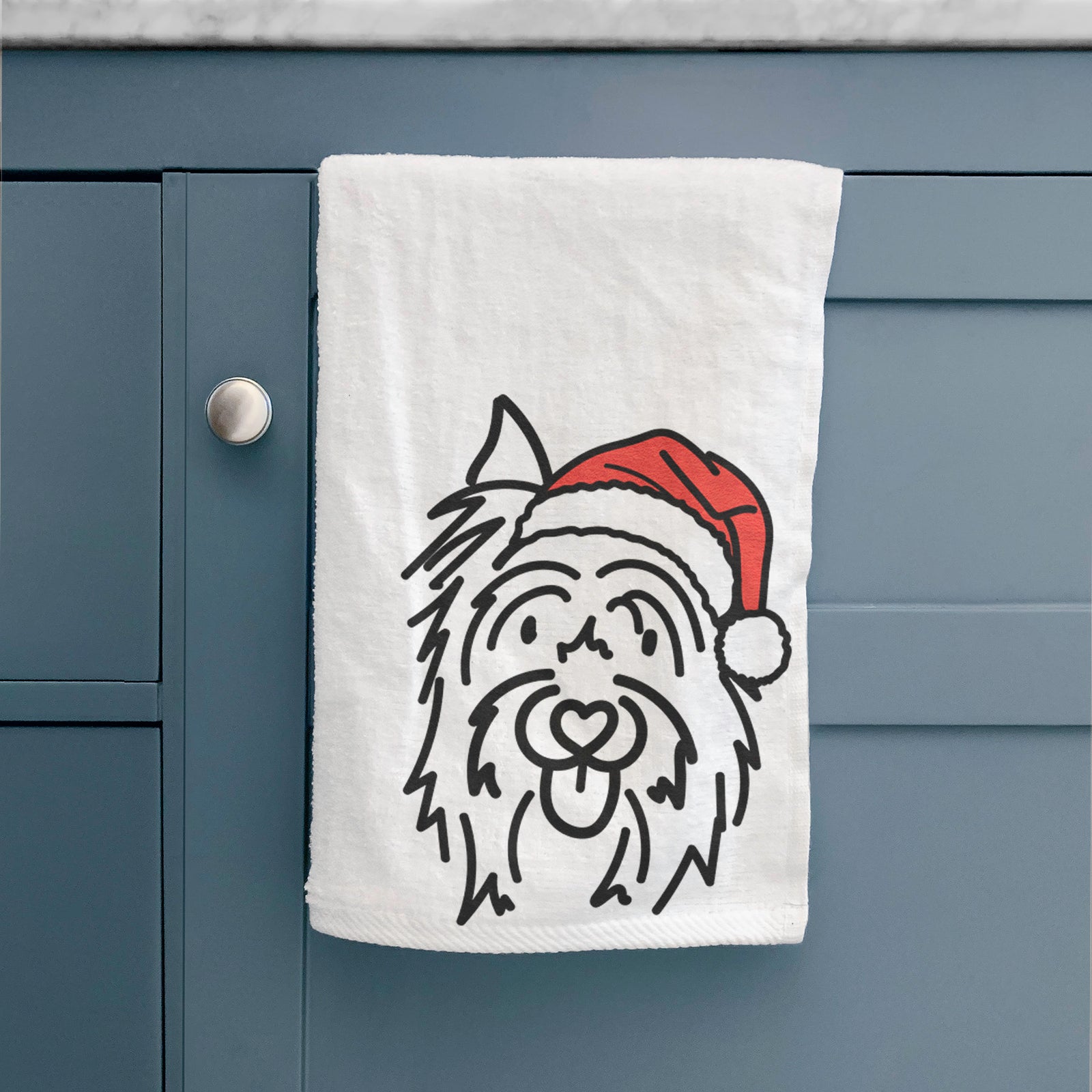 Minimalist line drawing of Monty the Silky Terrier wearing a Santa hat on a hand towel