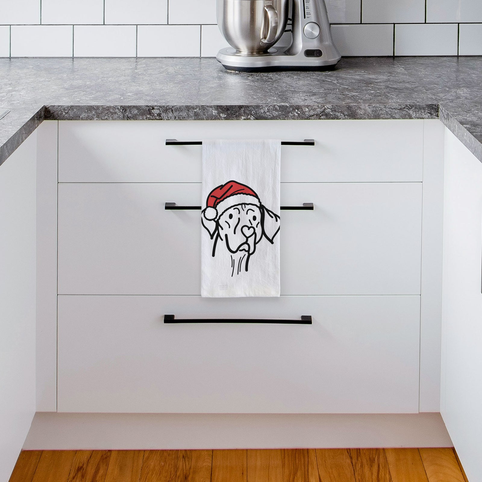 Minimalist line drawing of Moose the Vizsla wearing a Santa hat on a tea towel, hanging on an oven door in a kitchen