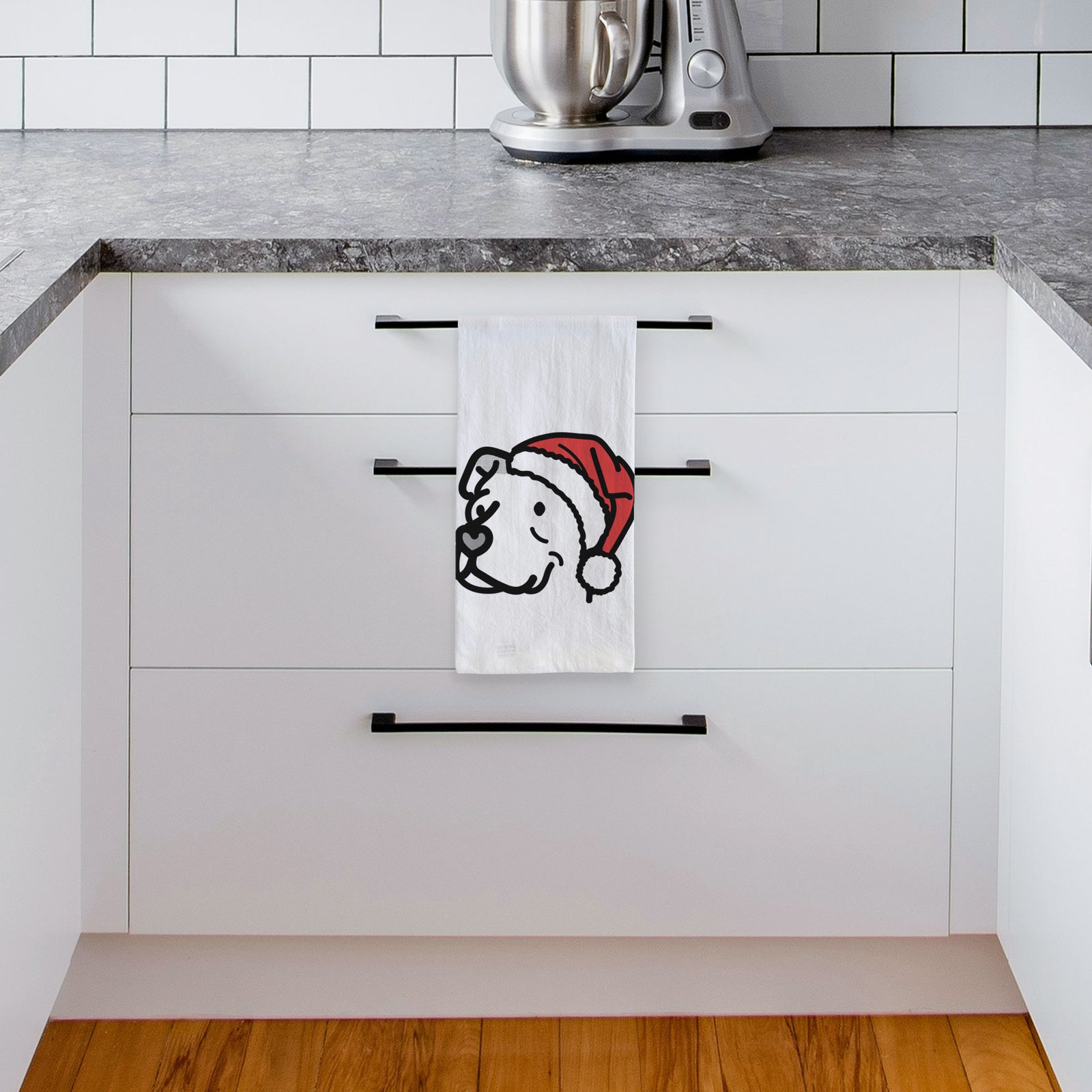 Minimalist line drawing of Mr. Sir the Pitbull Mix wearing a Santa hat on a tea towel, hanging on an oven door in a kitchen