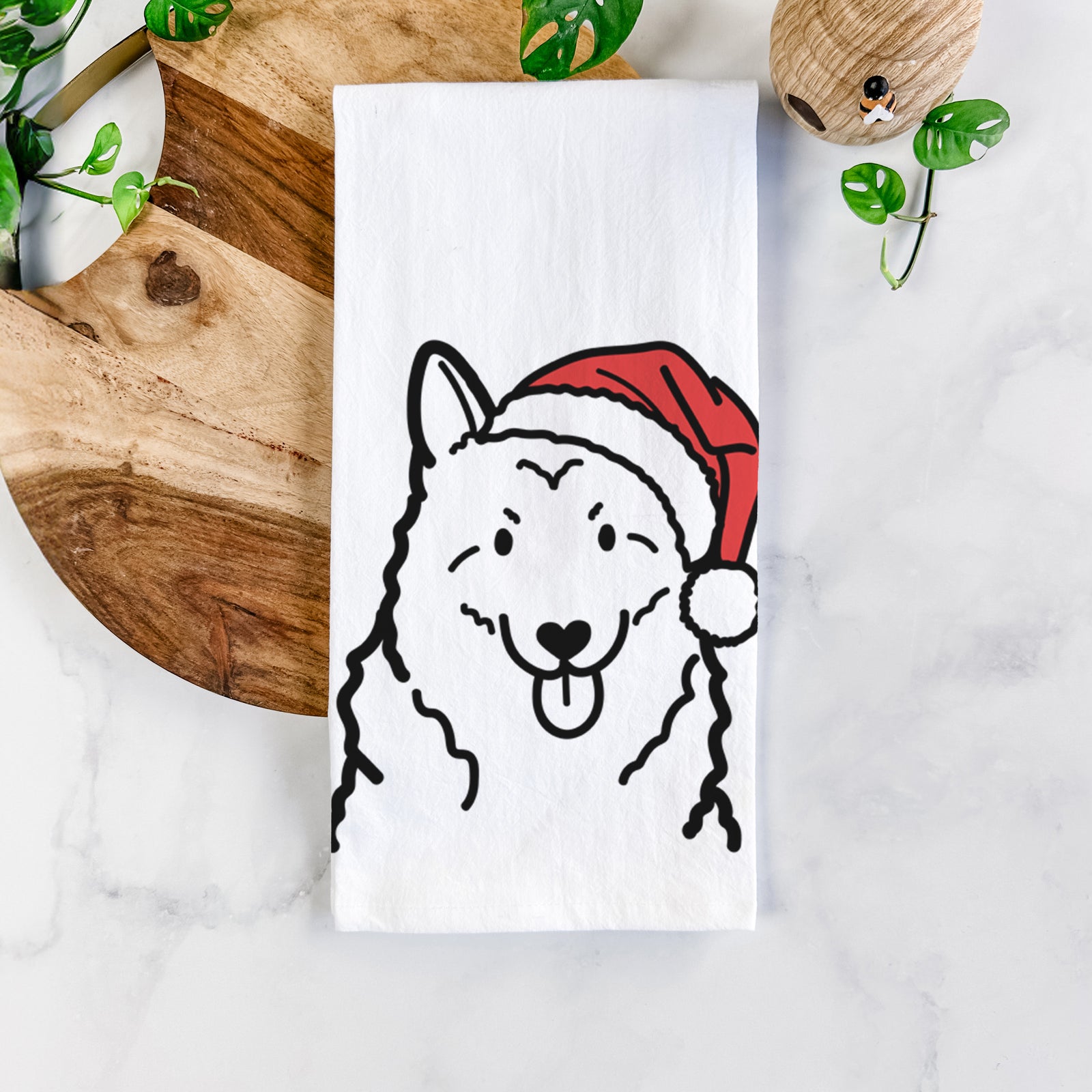 Minimalist line drawing of a Norwegian Elkhound wearing a Santa hat on a tea towel