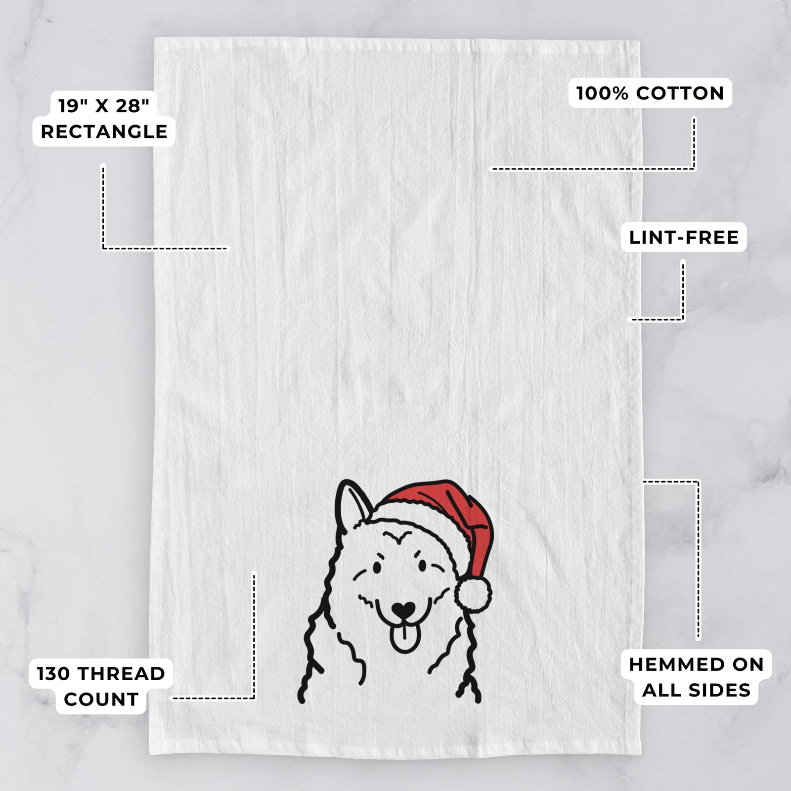 Minimalist line drawing of a Norwegian Elkhound wearing a Santa hat on a tea towel, with feature callouts: 19 x 28 inch rectangle, 100% cotton, lint-free, 120 thread count, hemmed on all sides